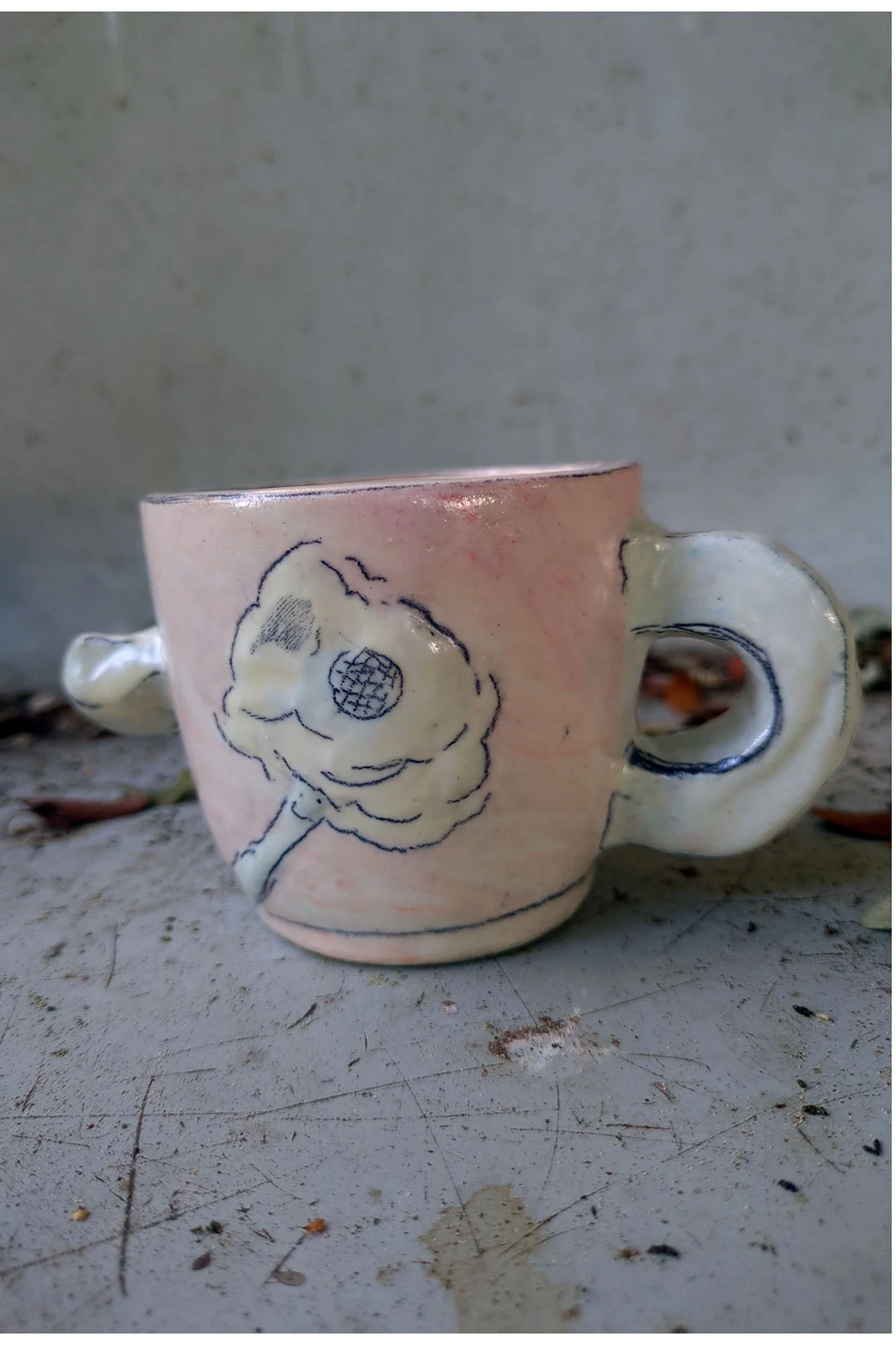 Cup Bearing the Image of a Flower Falling Forward