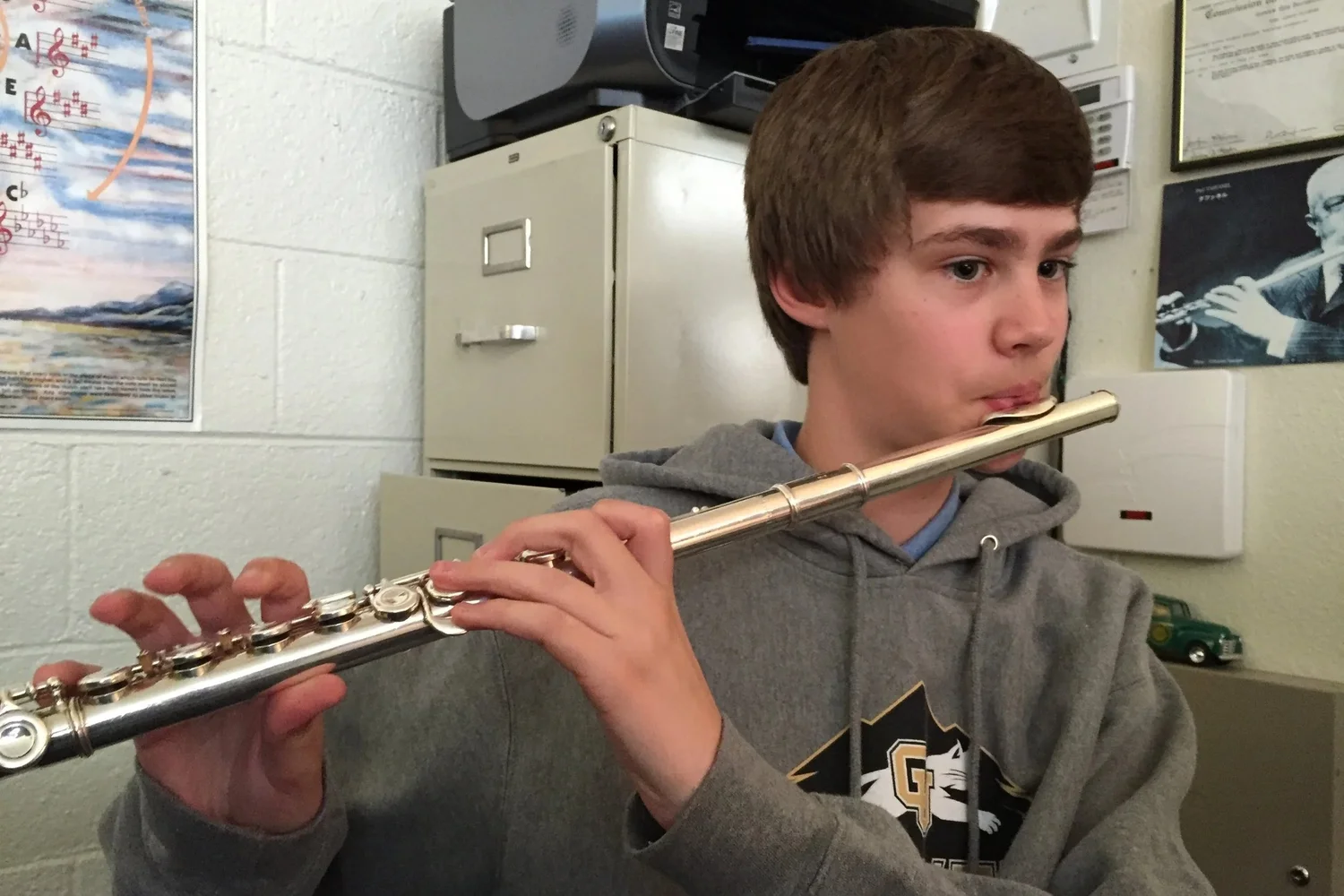 A flute student during a music lesson