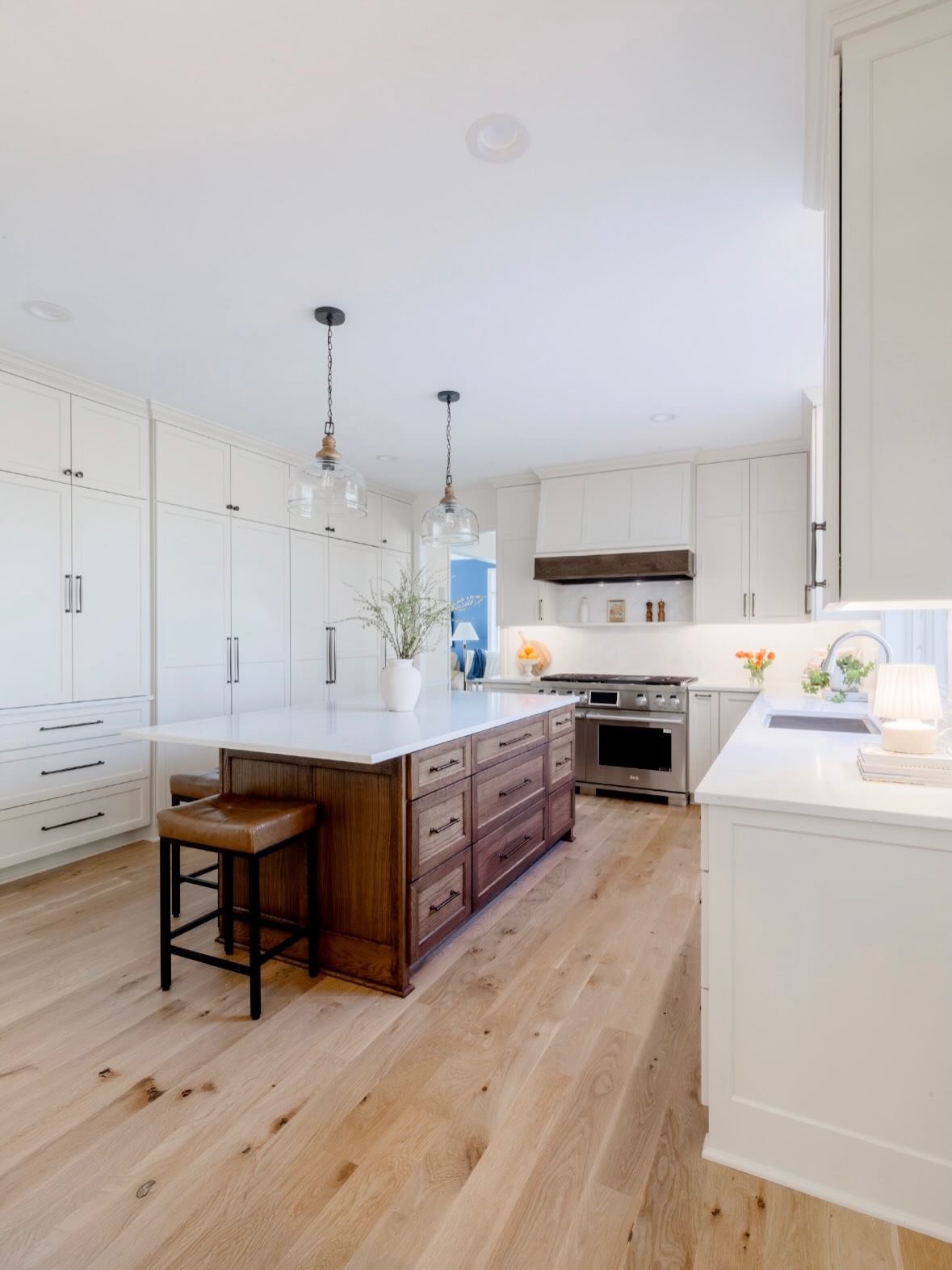 A kitchen remodel centered on function + warmth. More storage, a new statement range, and layered neutral finishes brought this space to life - complete with new flooring, cabinetry, countertops, and backsplash. 🤍

Designer + Builder: @lakestudiodes