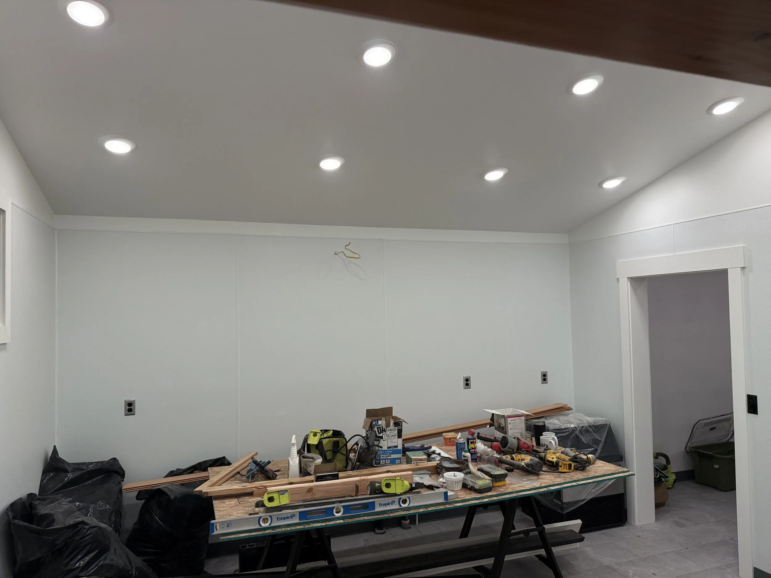 Recessed lighting installation during interior renovation project