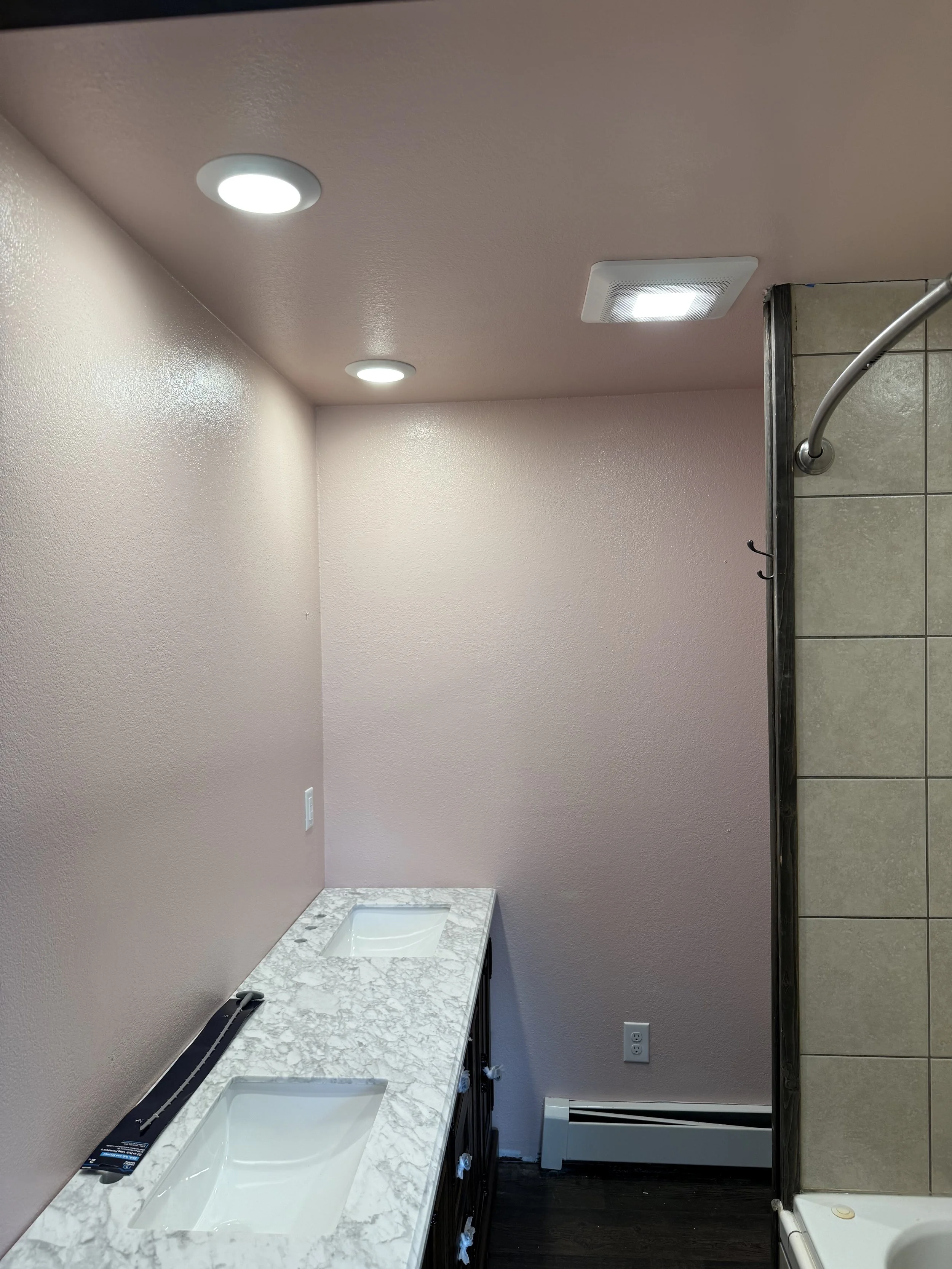 Recessed lighting installation during bathroom remodel