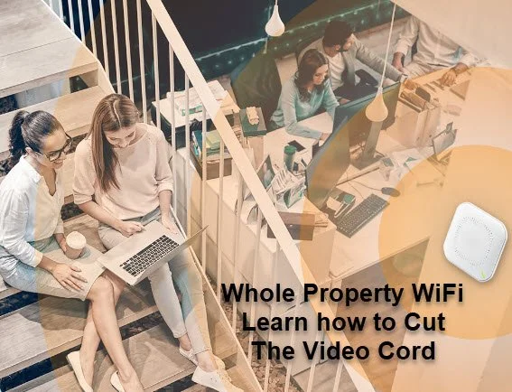 People working in a modern office with laptops and a WiFi device, with text overlay about Whole Property WiFi and video cord cutting.