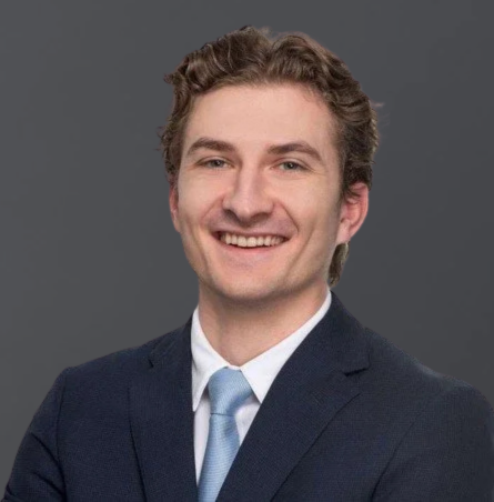 Portrait of a smiling young man in a business suit