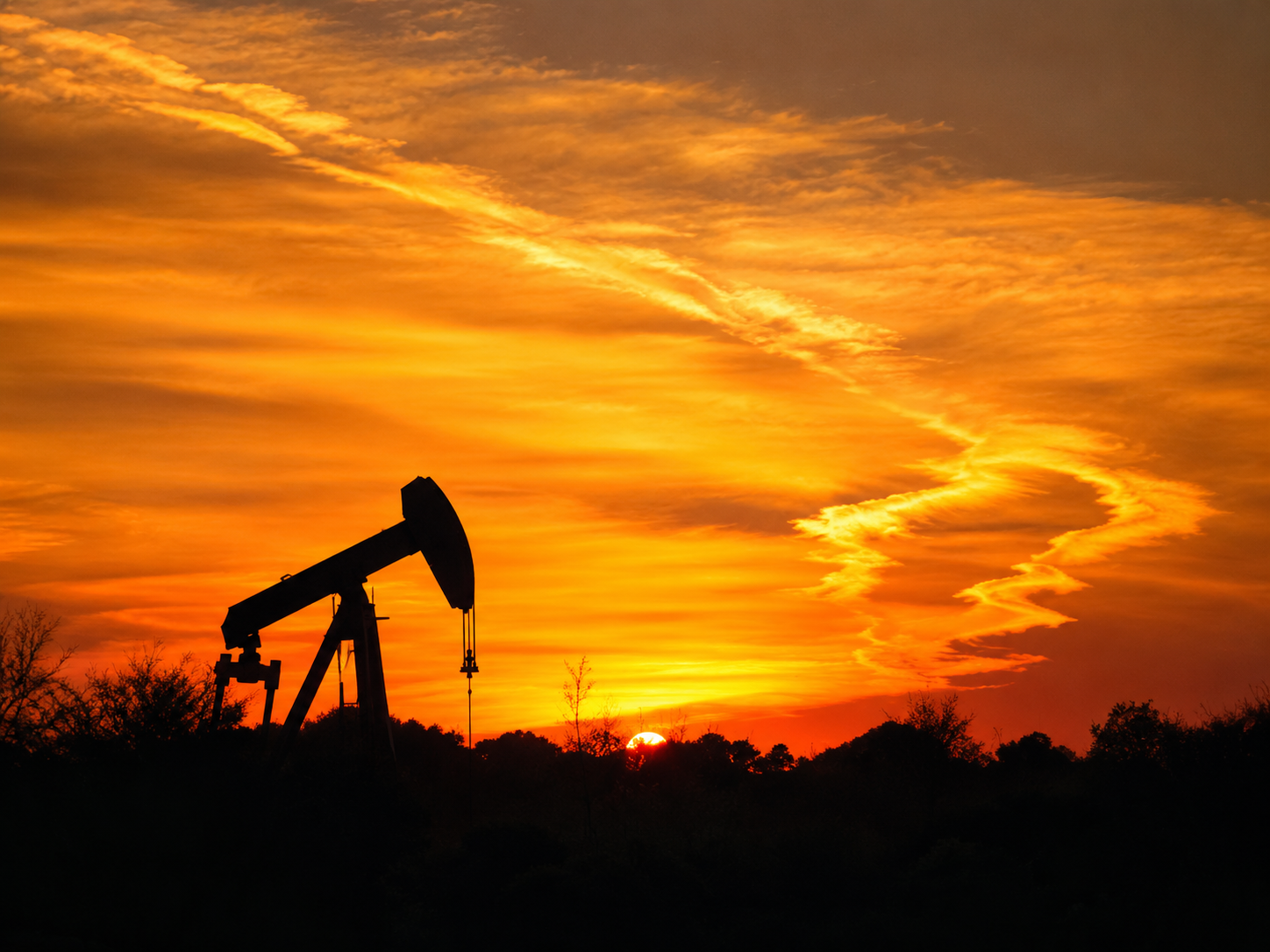 Sunset over an oil pumpjack