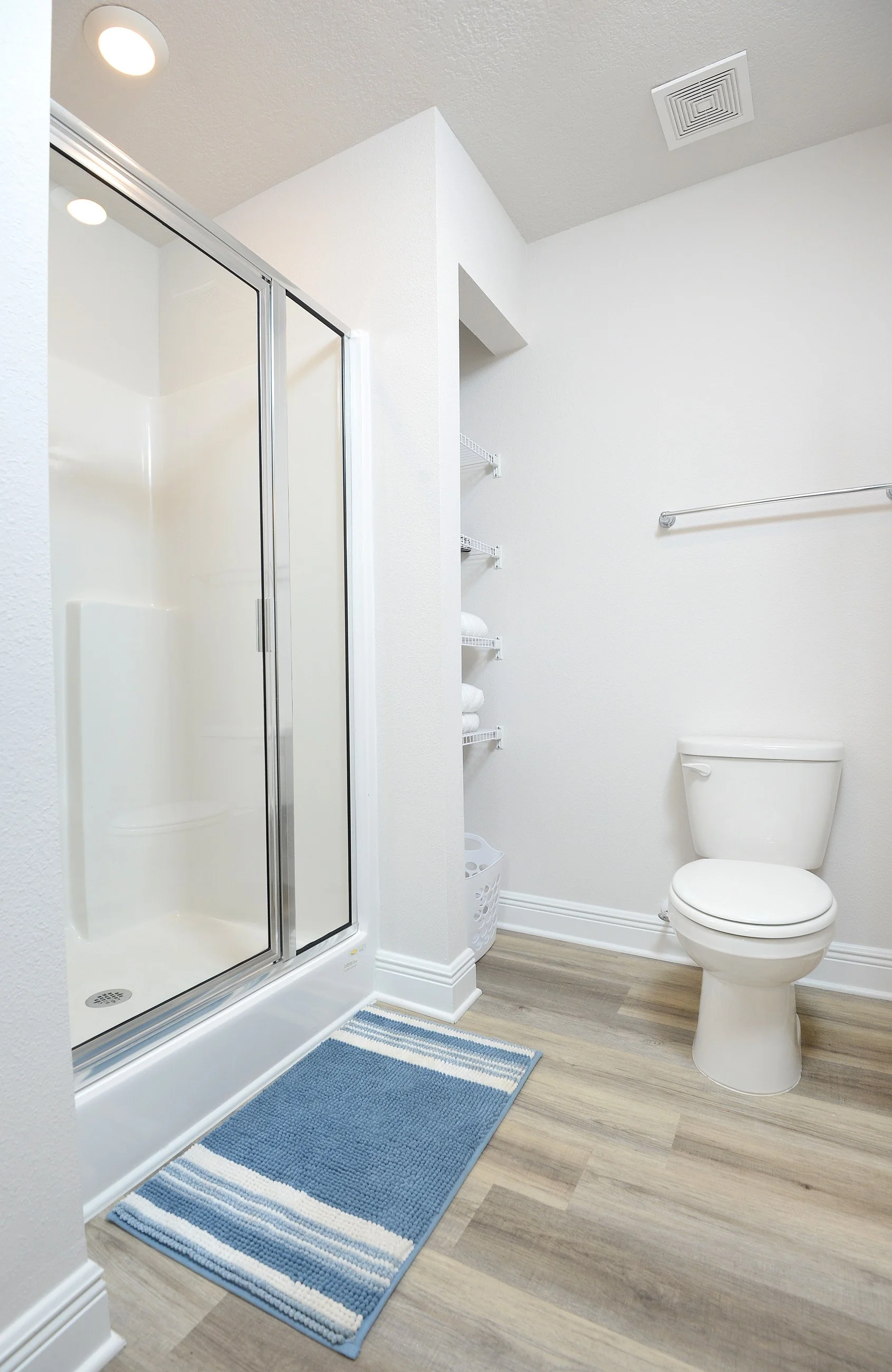 Master bathroom shower and toilet at Coastal Tide Escapes vacation rental in Panama City Beach Florida