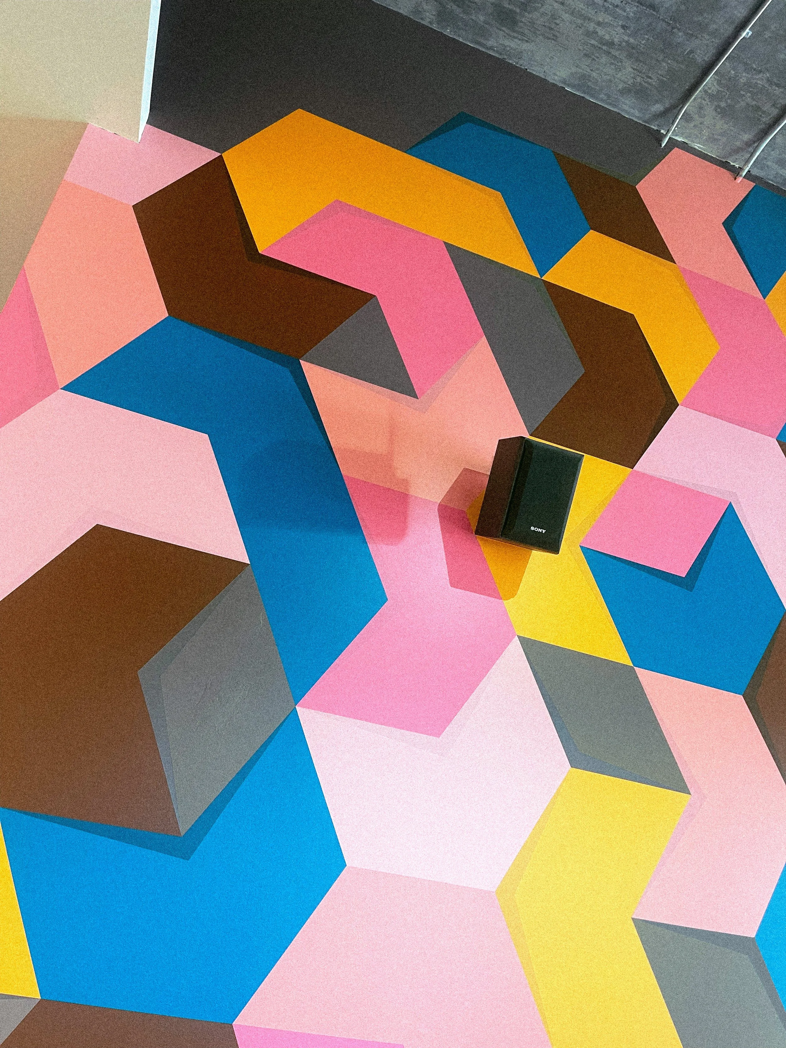 Full view of Andrew Haan’s geometric wall mural at Philz Coffee in Downtown Los Angeles.