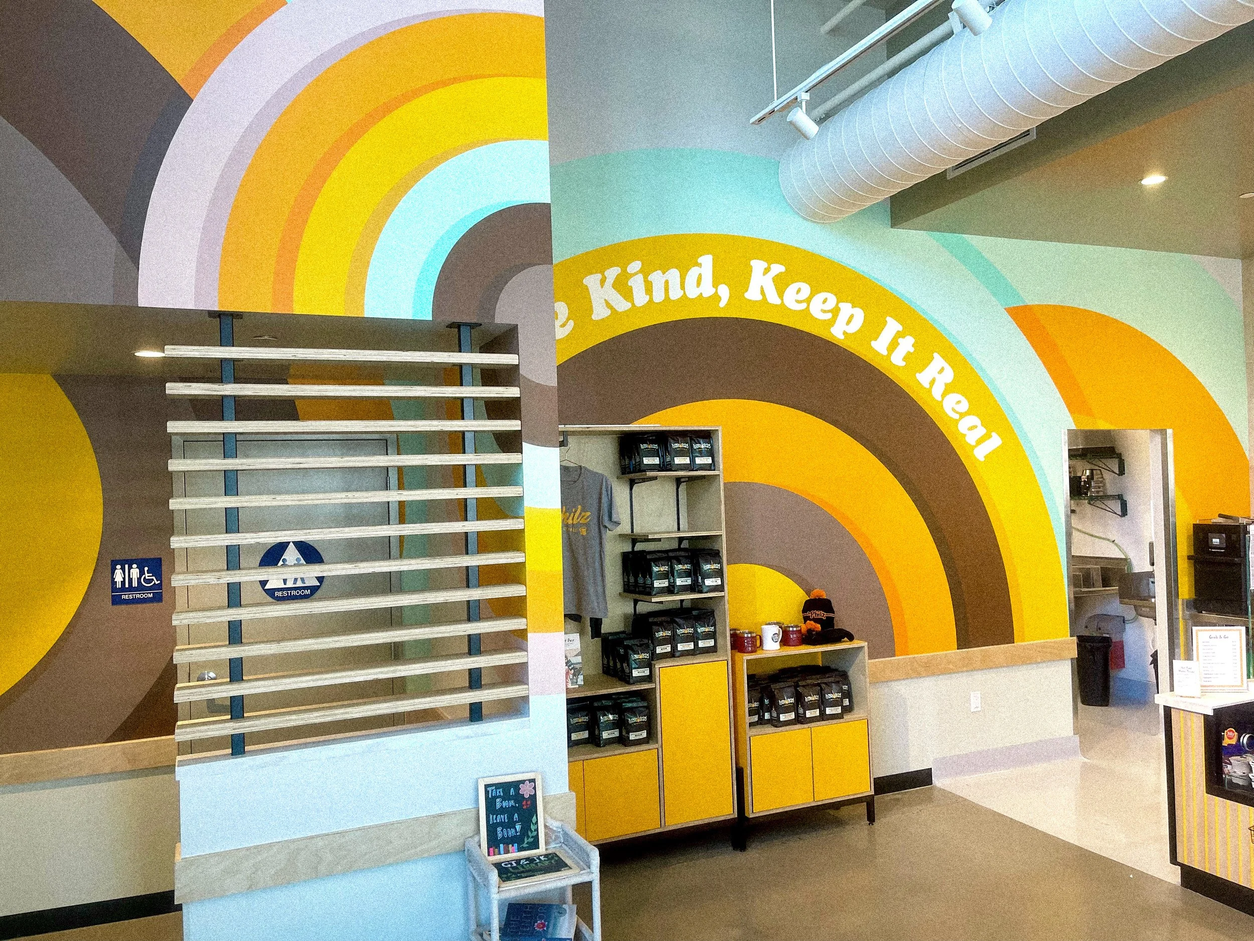 Colorful interior mural by Andrew Haan at Philz Coffee in Calabasas, California