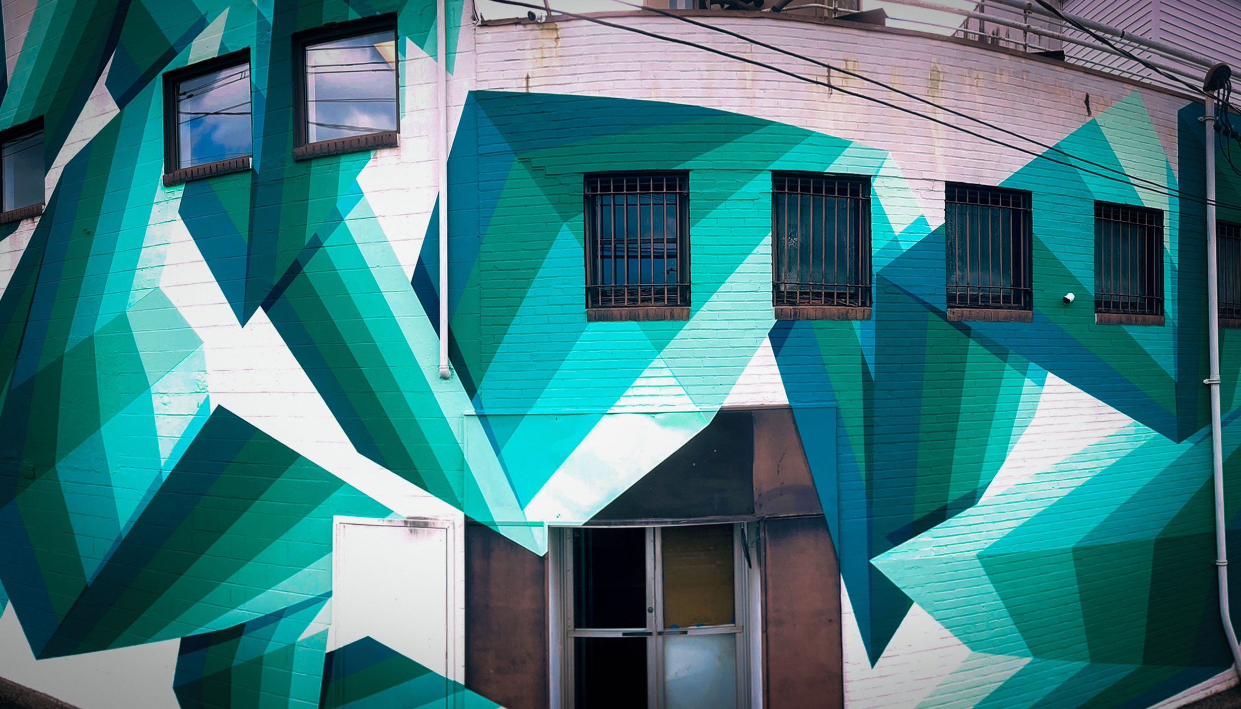 Large-scale contemporary geometric mural by California mural artist Andrew Haan in Los Angeles.