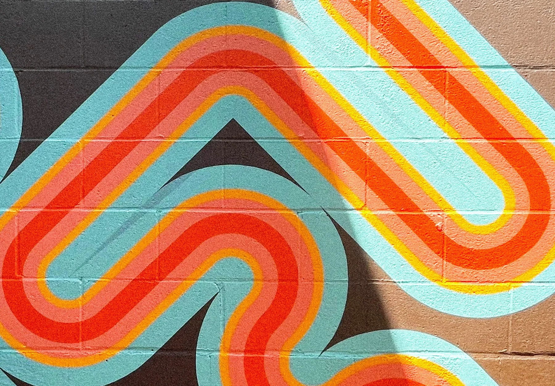 Colorful midcentury-inspired geometric exterior mural by Andrew Haan for a private residence in California