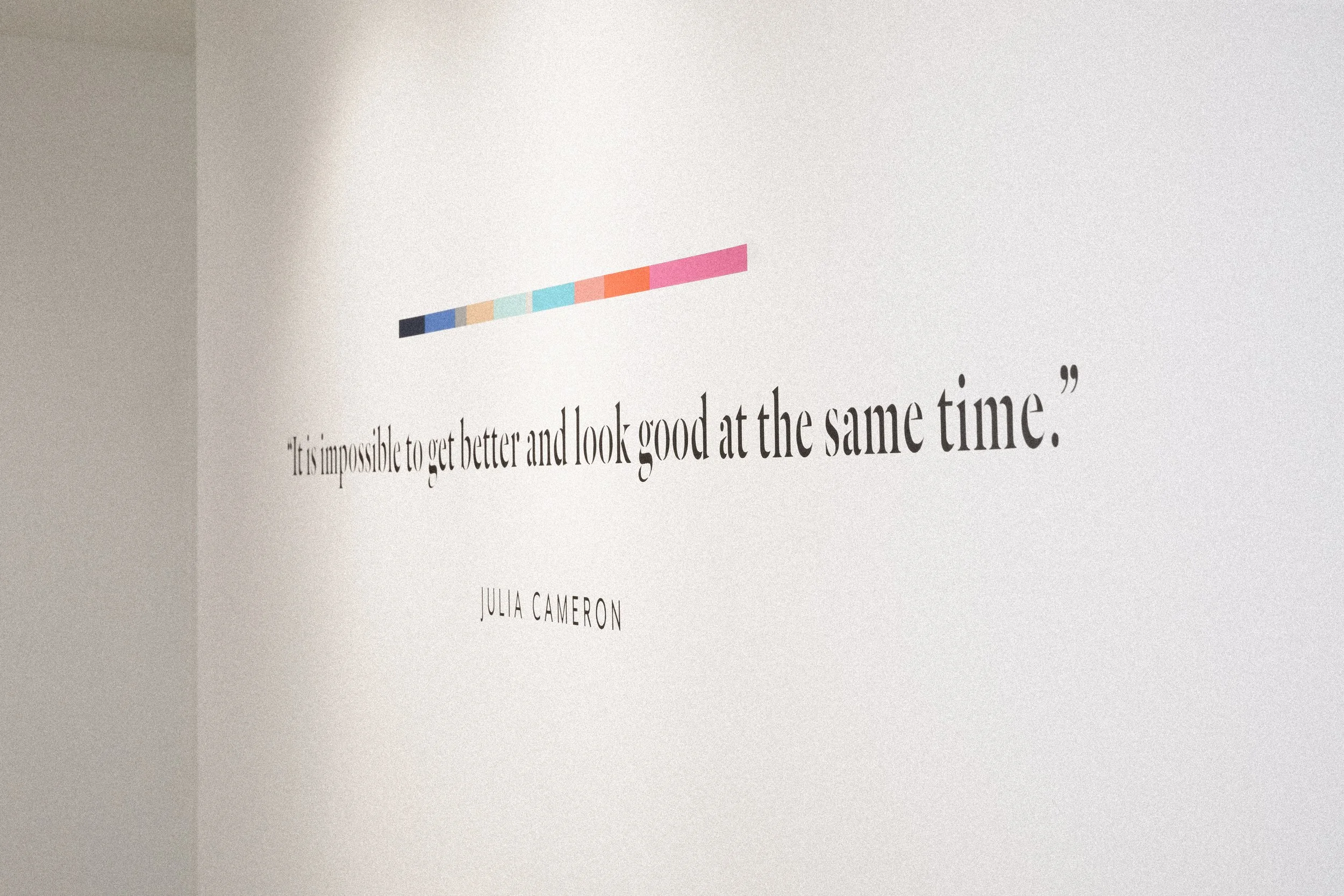 Typography quote mural with a colorful geometric accent inside Samarasa Yoga Studio in Los Angeles.