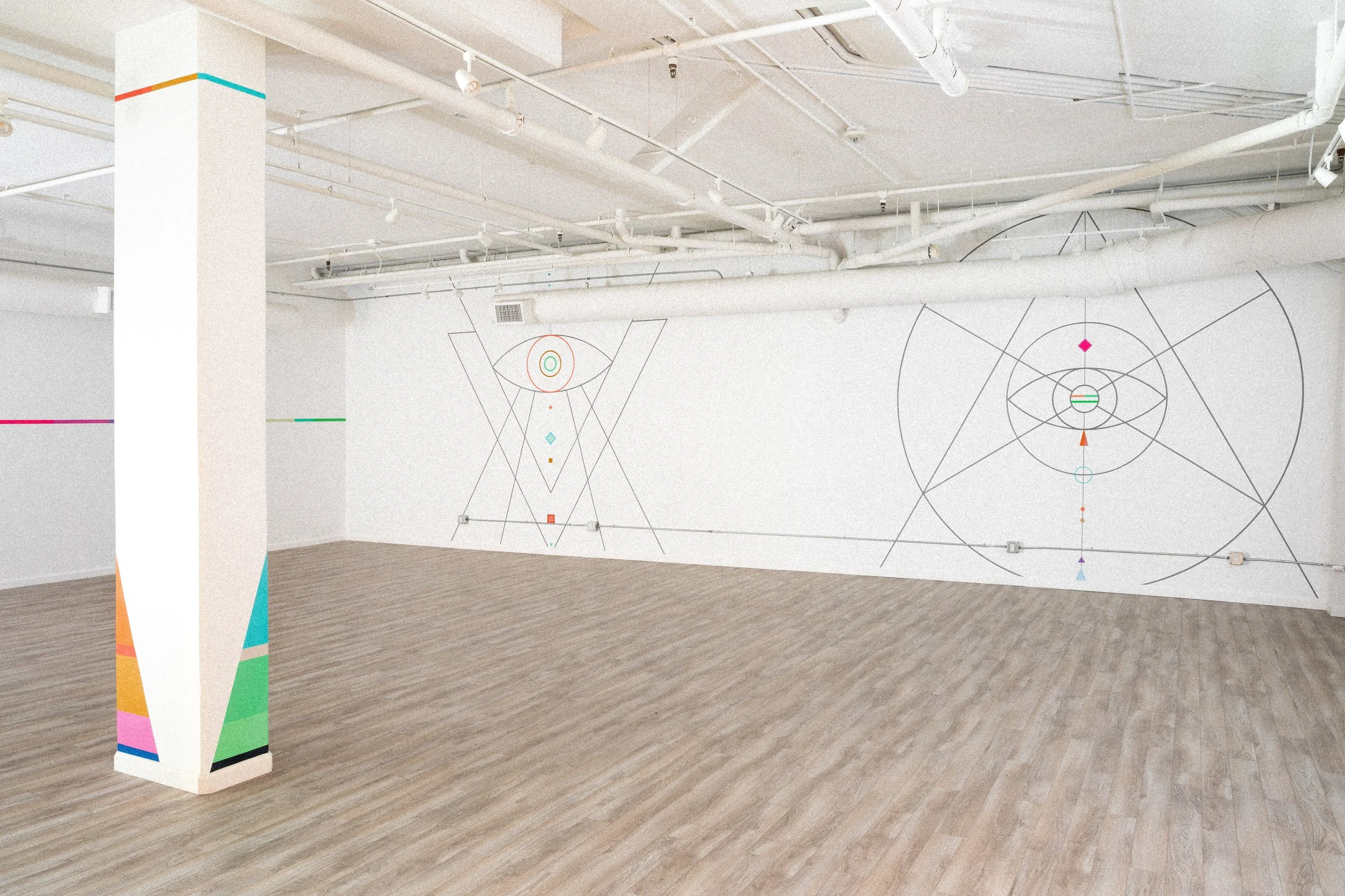 Two large geometric line murals spanning the interior of Samarasa Yoga Studio in Los Angeles.