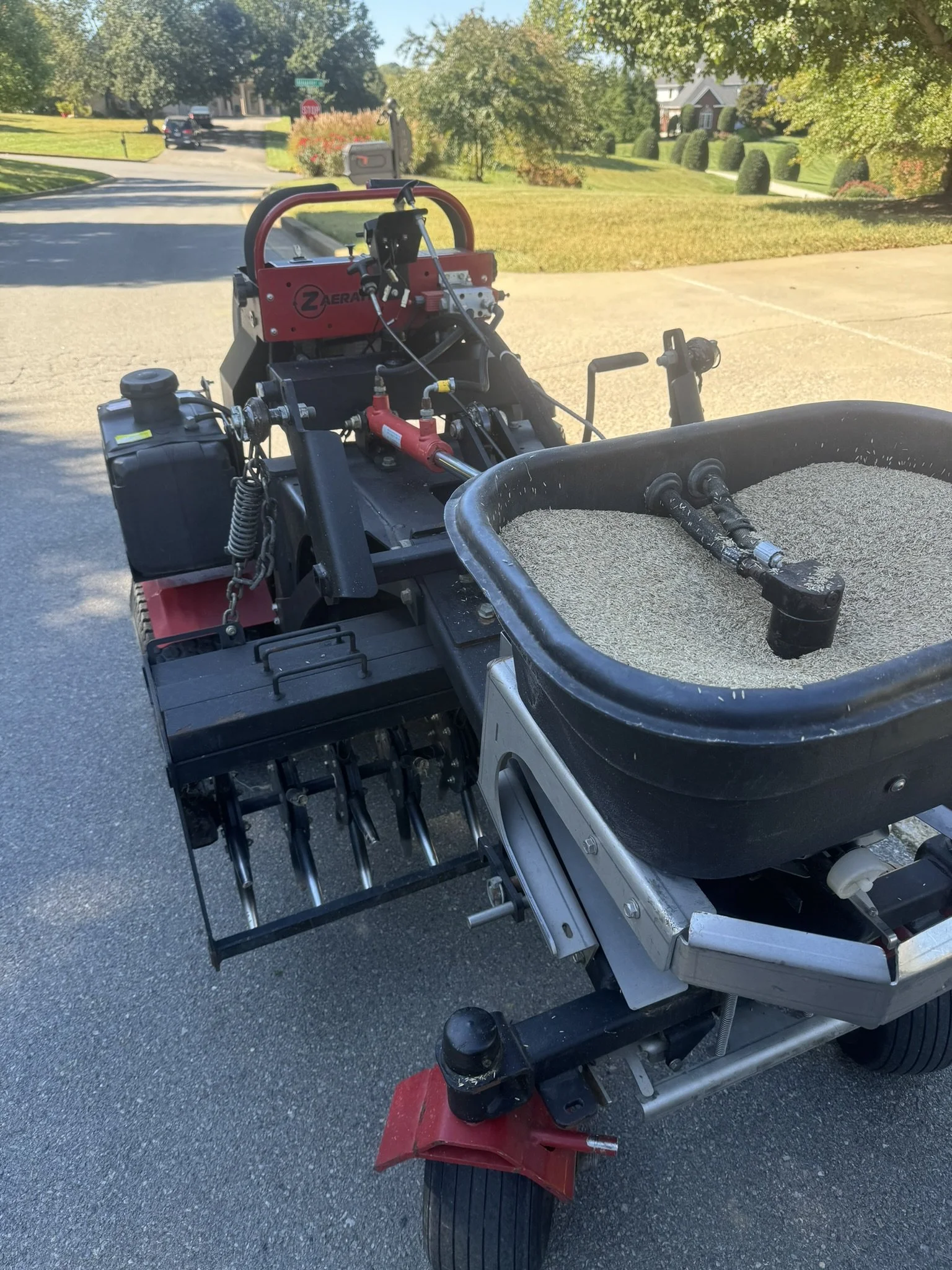 Professional lawn aeration and overseeding service promoting thicker grass and healthier turf in Northeast Tennessee.