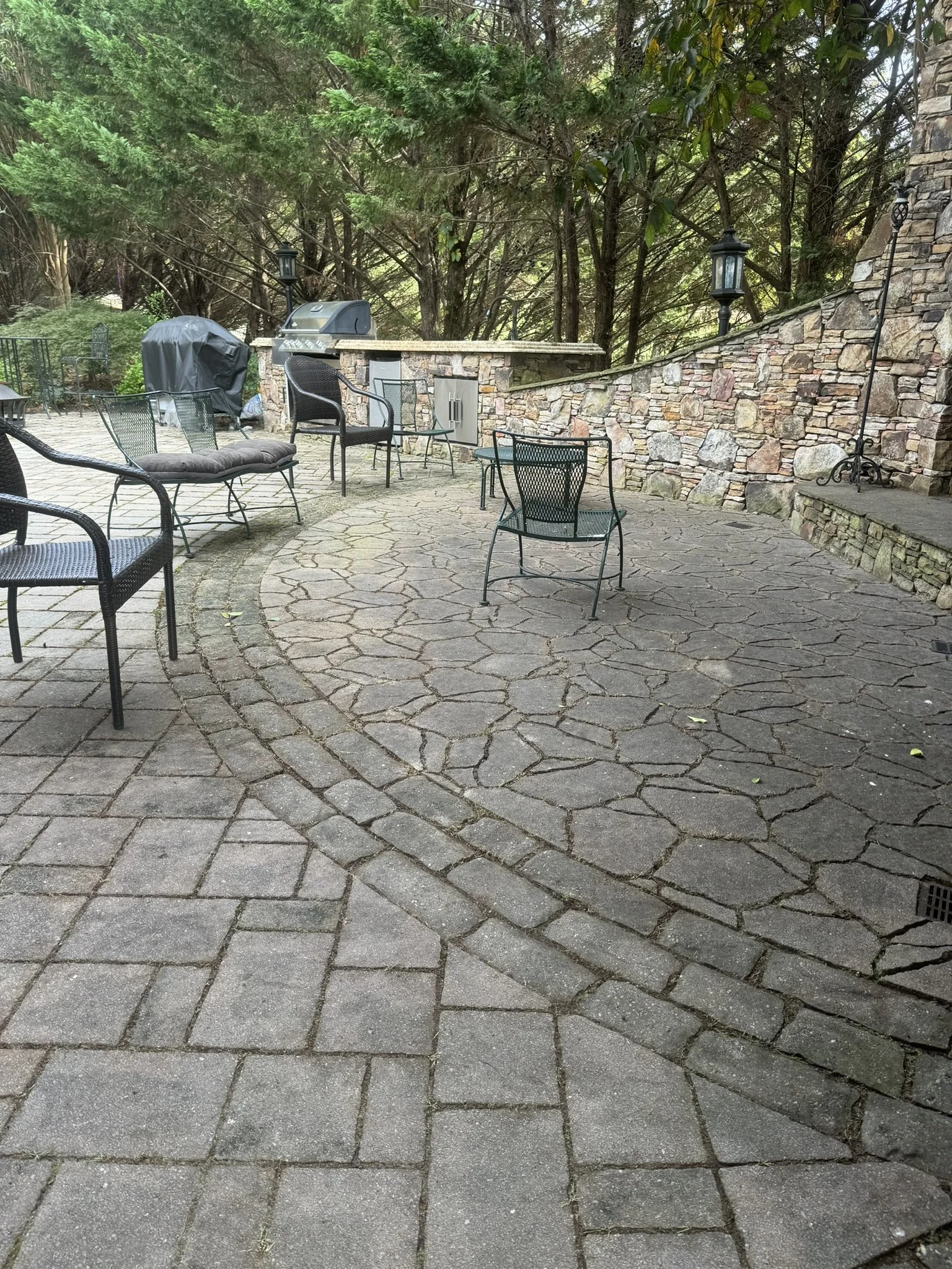 Clean and restored stone patio after professional hardscape maintenance and weed removal.