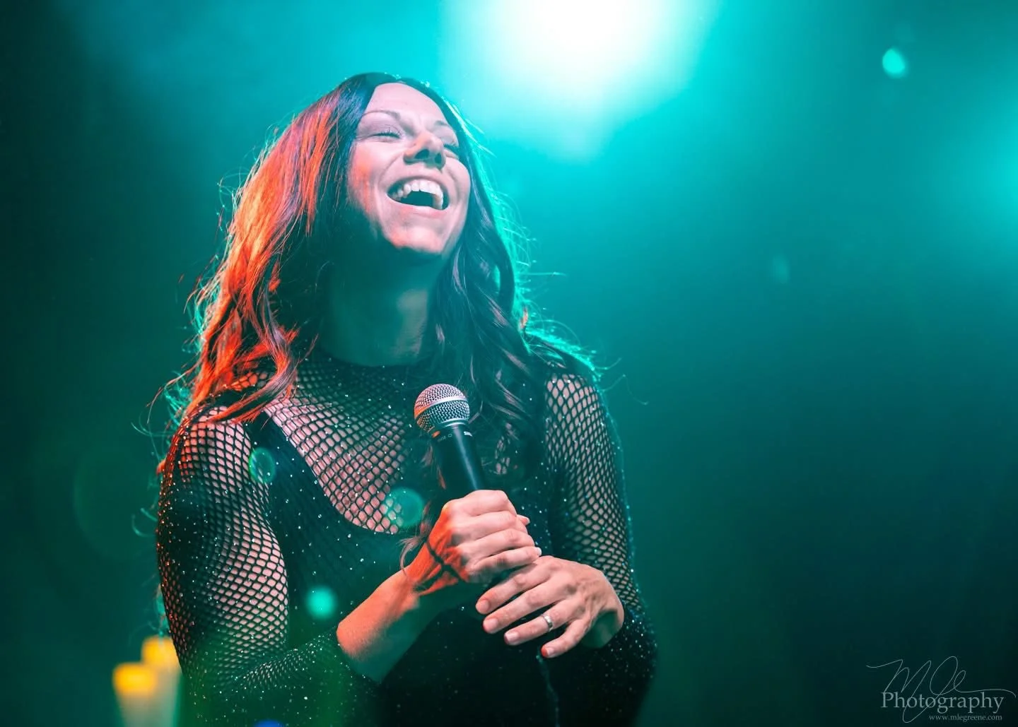 Sarah Moon as Alanis Morissette, performing at an Infatuation Junkie Live Performance.