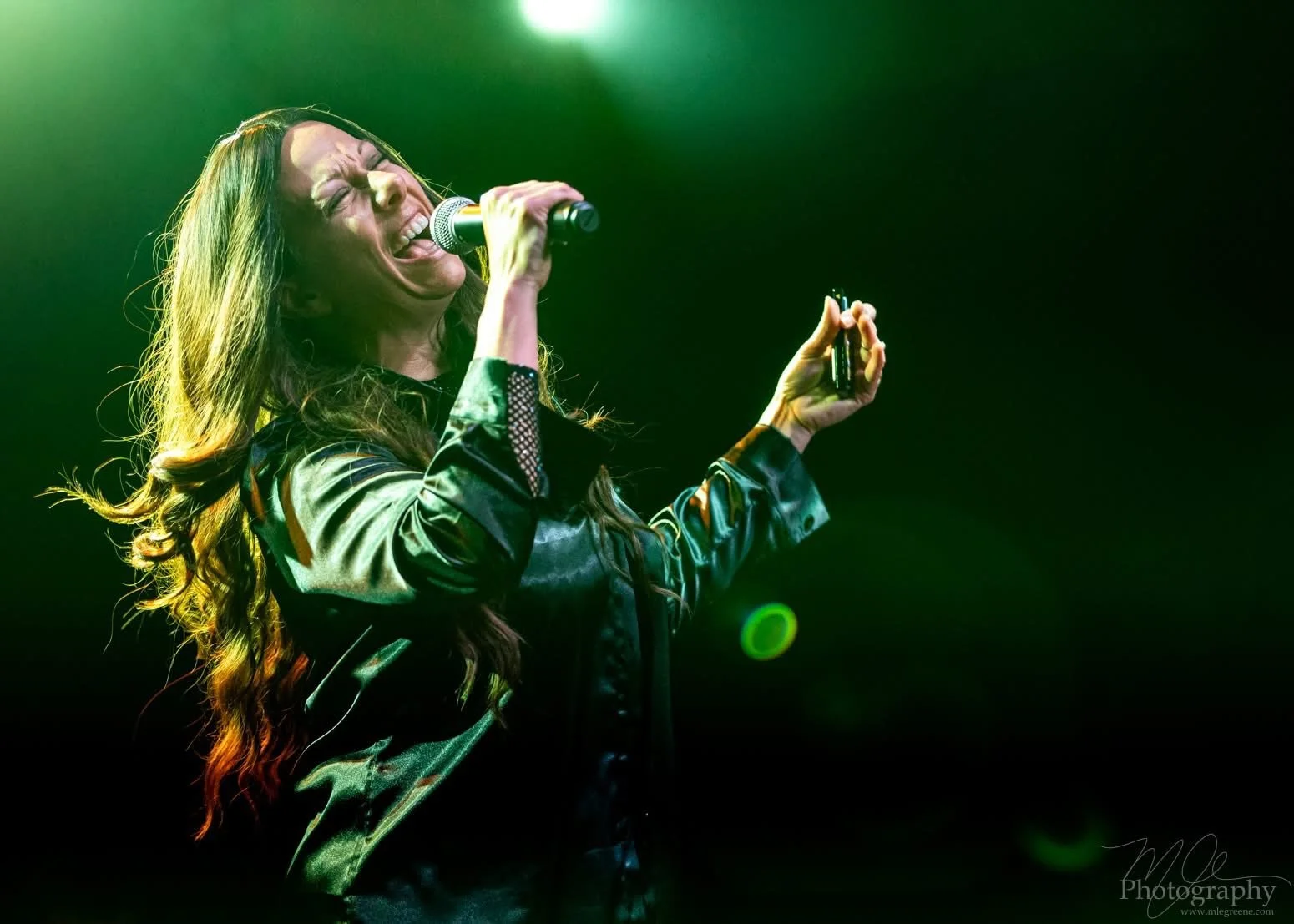 Sarah Moon as Alanis Morissette, performing at an Infatuation Junkie Live Performance.