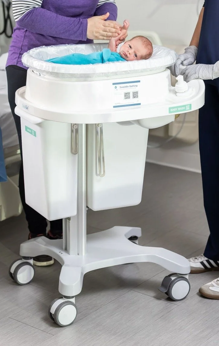 Baby in the  'Swaddle Bathing' cart.