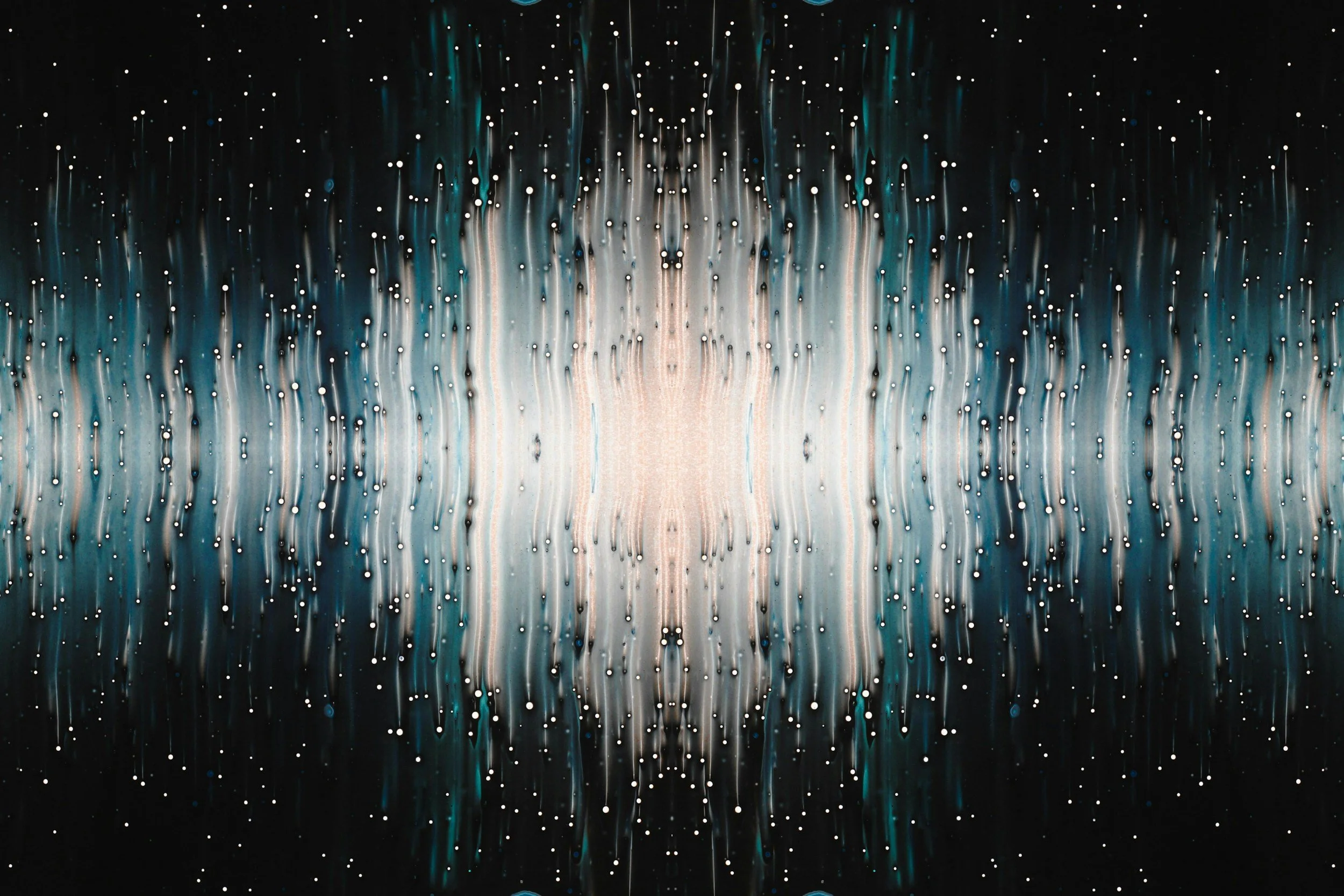 Abstract image of water droplets on a glass surface with streaks of blue, white, and black colors creating a digital rain or fiber optic effect.