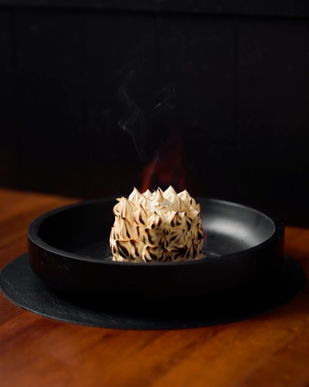 A little theatre to finish the evening. 

Torched meringue, bright citrus, and layers of delicate sweetness &mdash; as beautiful to watch as it is to eat.