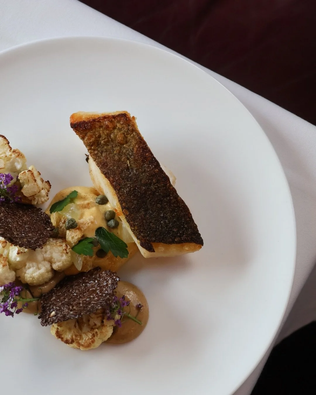 Today&rsquo;s catch, the chef&rsquo;s touch.

Le poisson du jour - a fresh market selection, cooked &agrave; la fa&ccedil;on du chef, where seasonality, technique and flavour take centre stage. 

Served with delicate textures of cauliflower, crisp li