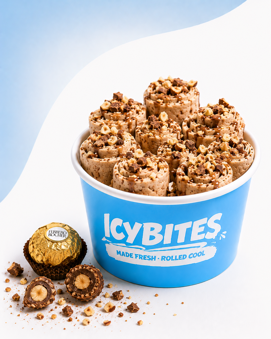A blue bucket labeled 'Icy Bites' filled with rolled chocolate hazelnut pralines topped with chopped nuts and chocolate drizzle, with additional pralines and scattered crumbs beside it.