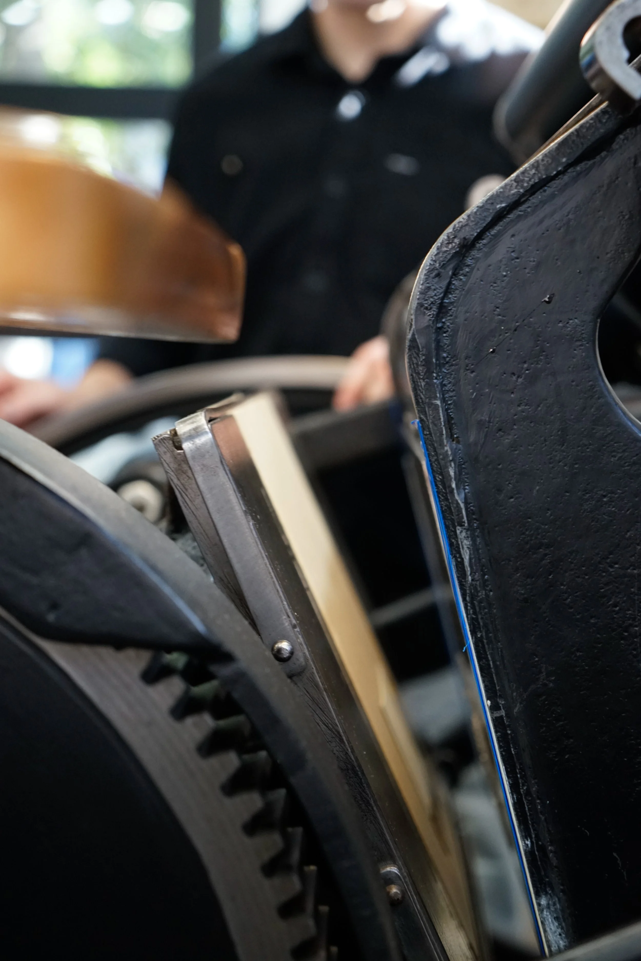 Close-up of mechanical parts, including gears and metal components, possibly part of a machine or device.