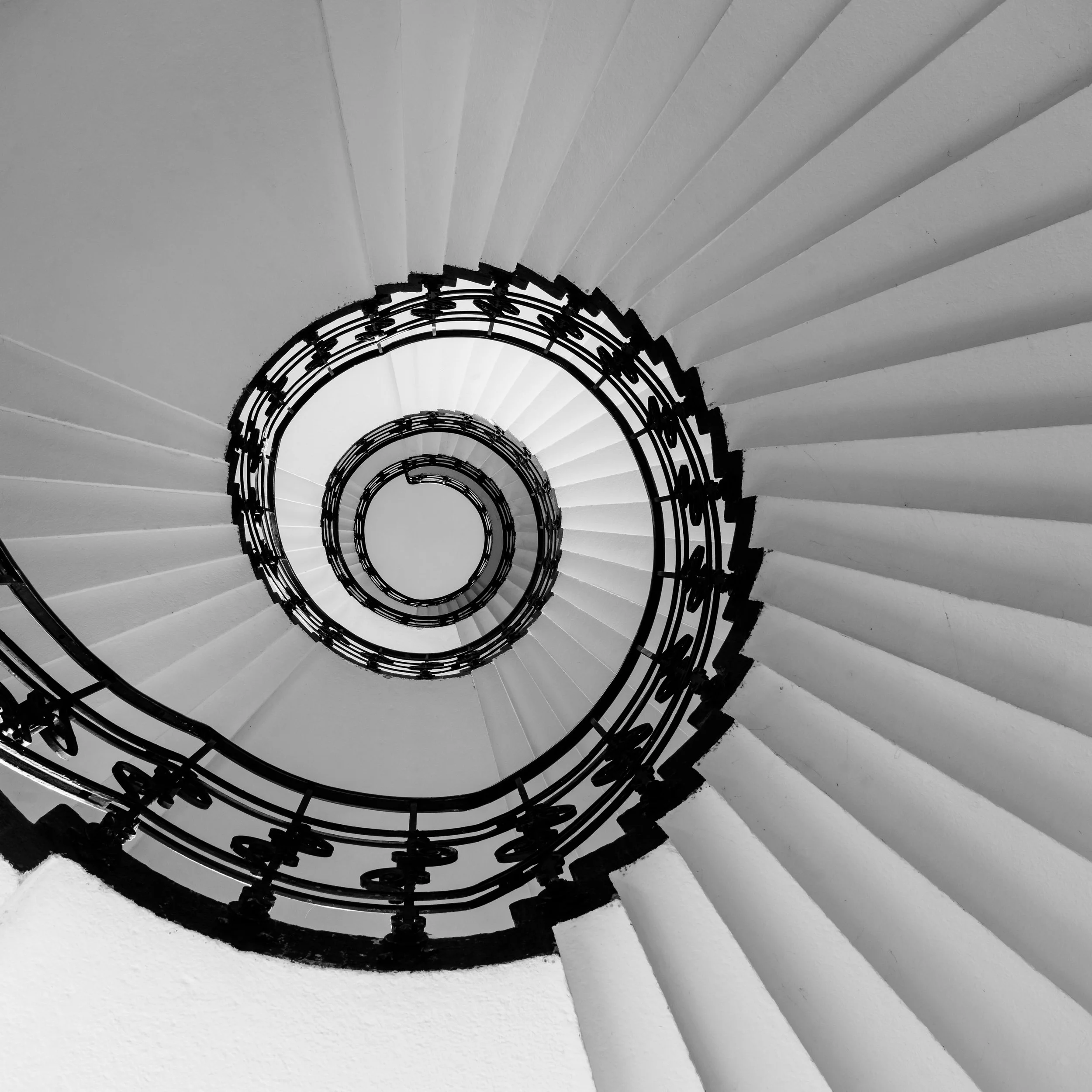 Spiral staircase architectural detail — recognition awarded to venues built on operational discipline.