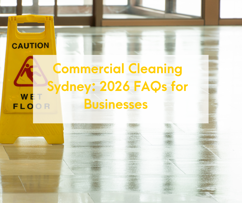 A Blog Post for Douglas Wright Cleaning Group. A yellow caution wet floor sign in front of a reflective wooden floor near glass doors, with overlay text reading 'Commercial Cleaning Sydney: 2026 FAQs for Businesses'.