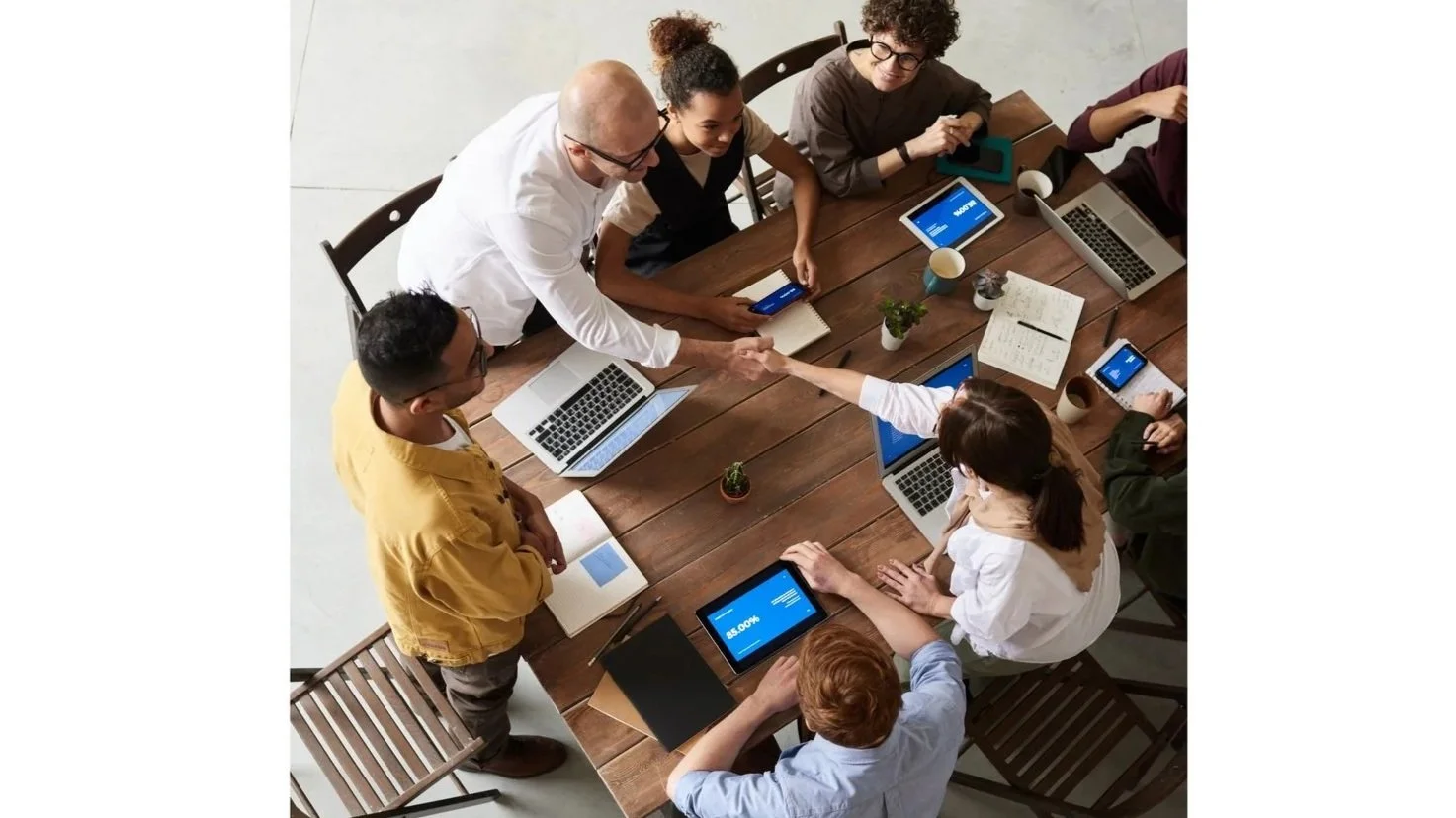 Startup team collaborating in a meeting while planning scalable IT systems and Google Workspace processes for a growing business.