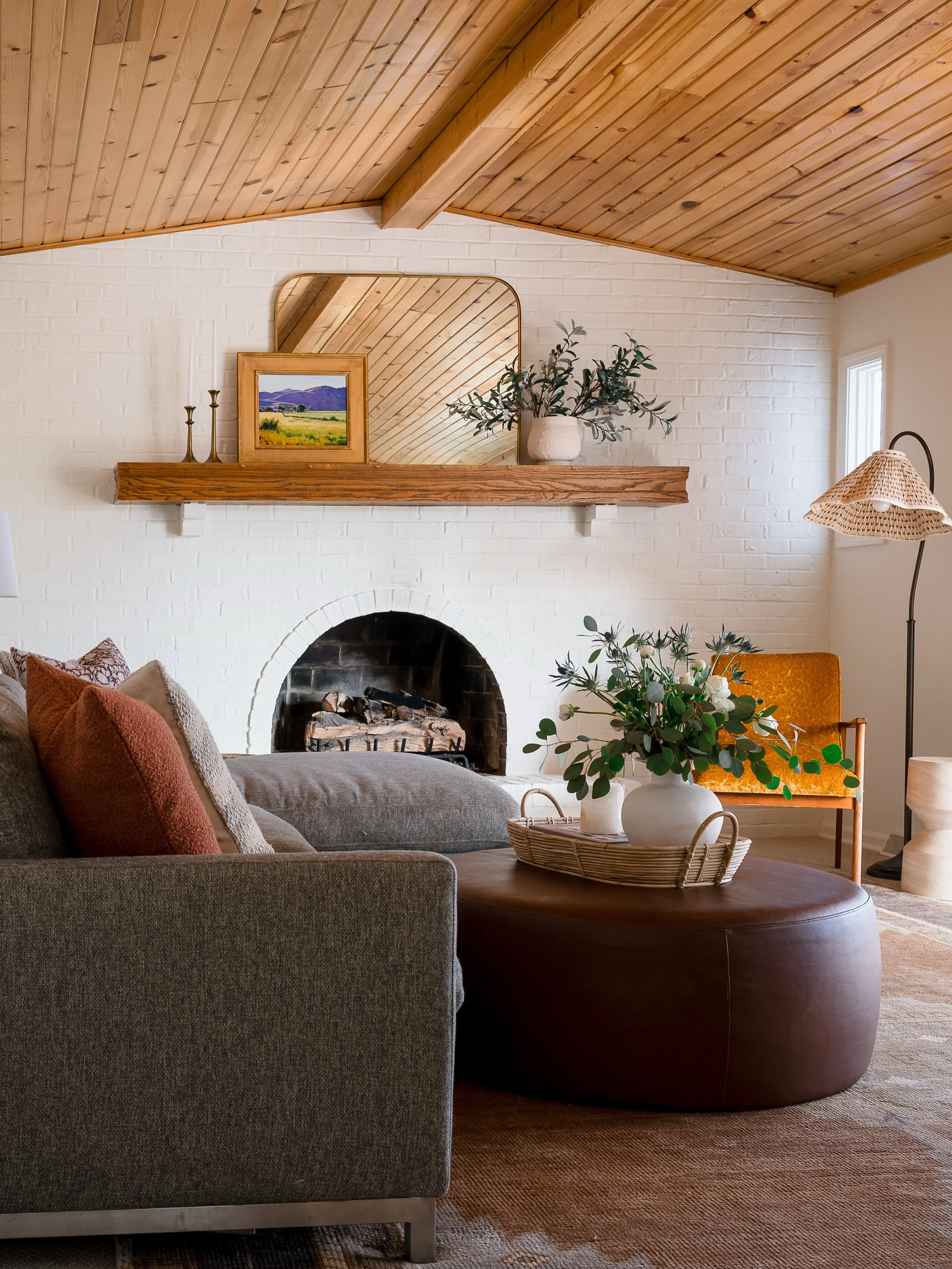 Oldie but a goodie. 🤎

Still love all the texture in this space. The wood ceiling, brick fireplace, natural light, and furnishings were all designed to play up the home&rsquo;s natural beauty rather than compete with it.

We mixed our client&rsquo;s
