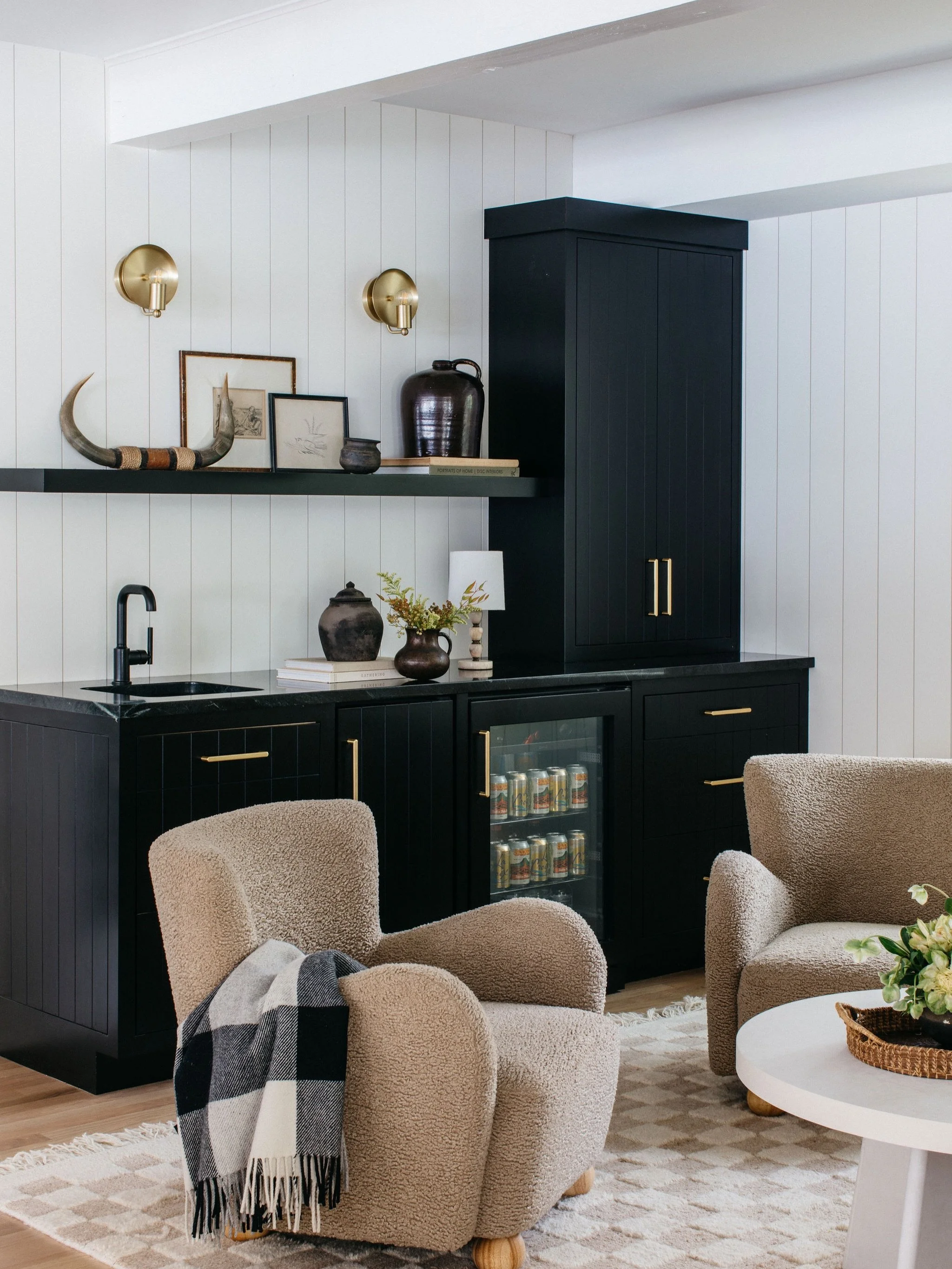 Watching a space take shape, from vibe to drawings to render to reality.

The vision was functional and clean, yet layered and personal. Textural neutrals against ebony stained cabinetry. Collected pieces mixed in. A home for the vinyl collection. Fo
