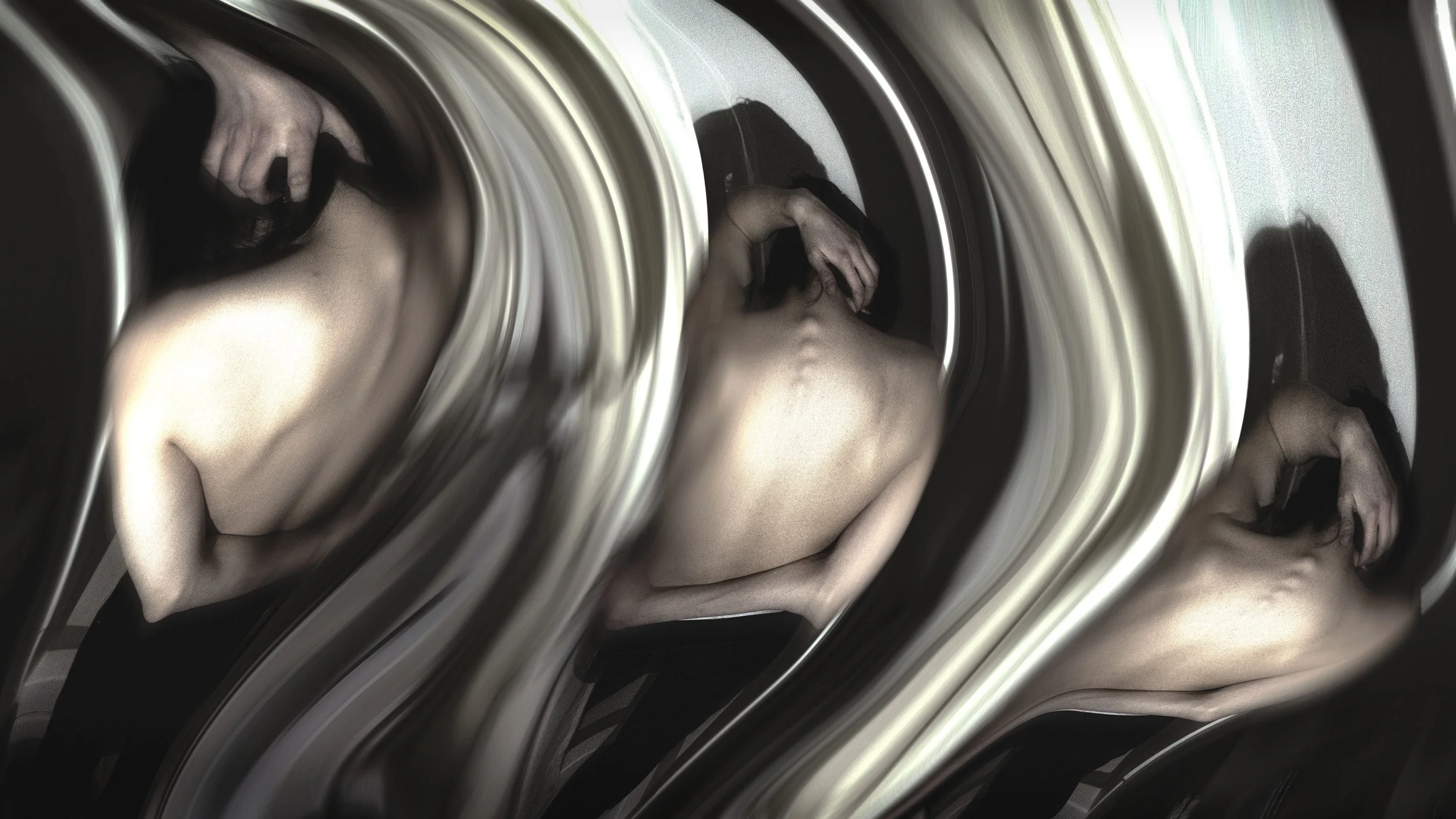 A woman is inside a washing machine drum, with the door closed, and nearby distorted reflections of her body and face.