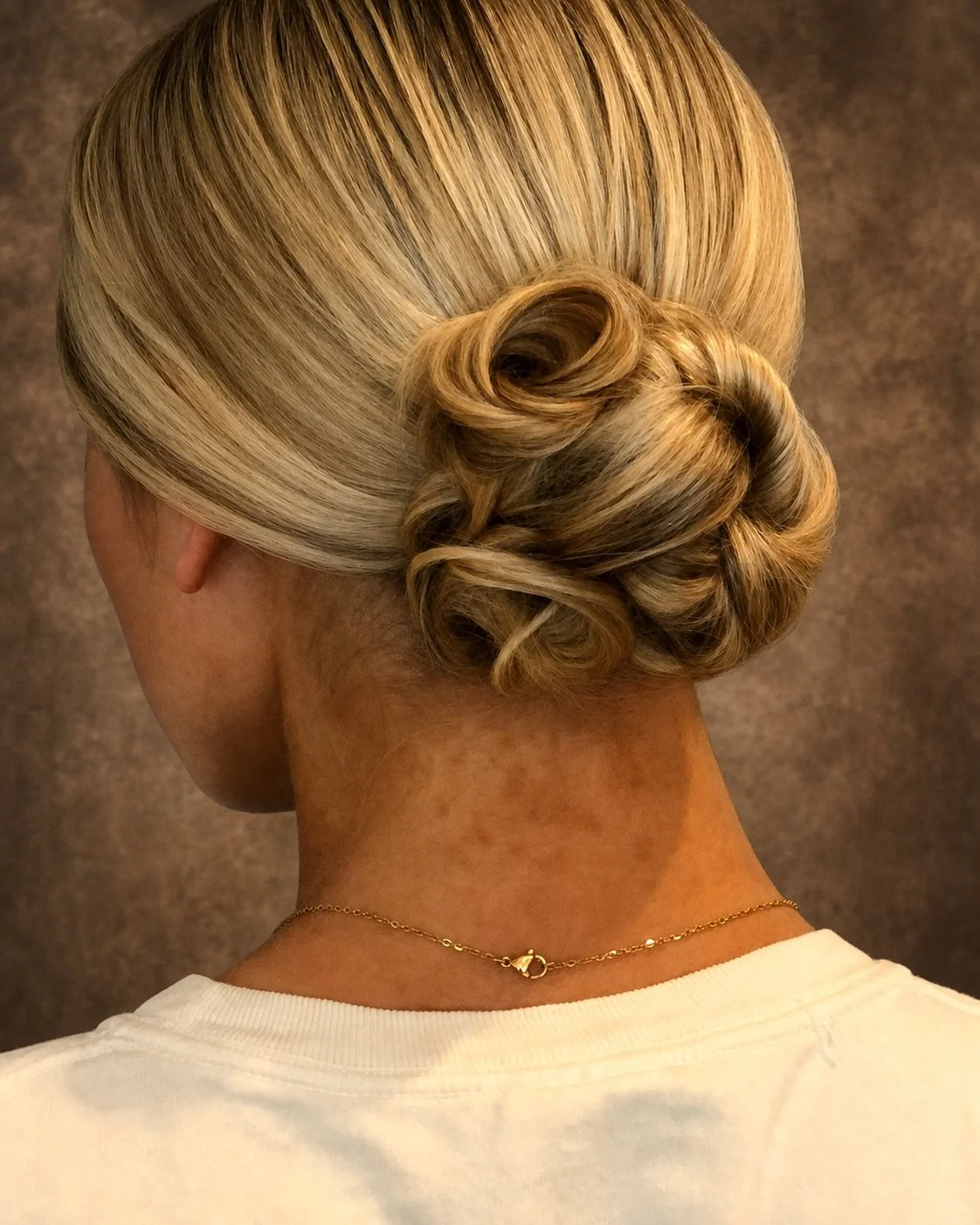 Elegant special occasion updo created by Meg in Mill Valley, featuring a polished low bun designed for weddings, galas, proms, and formal events.