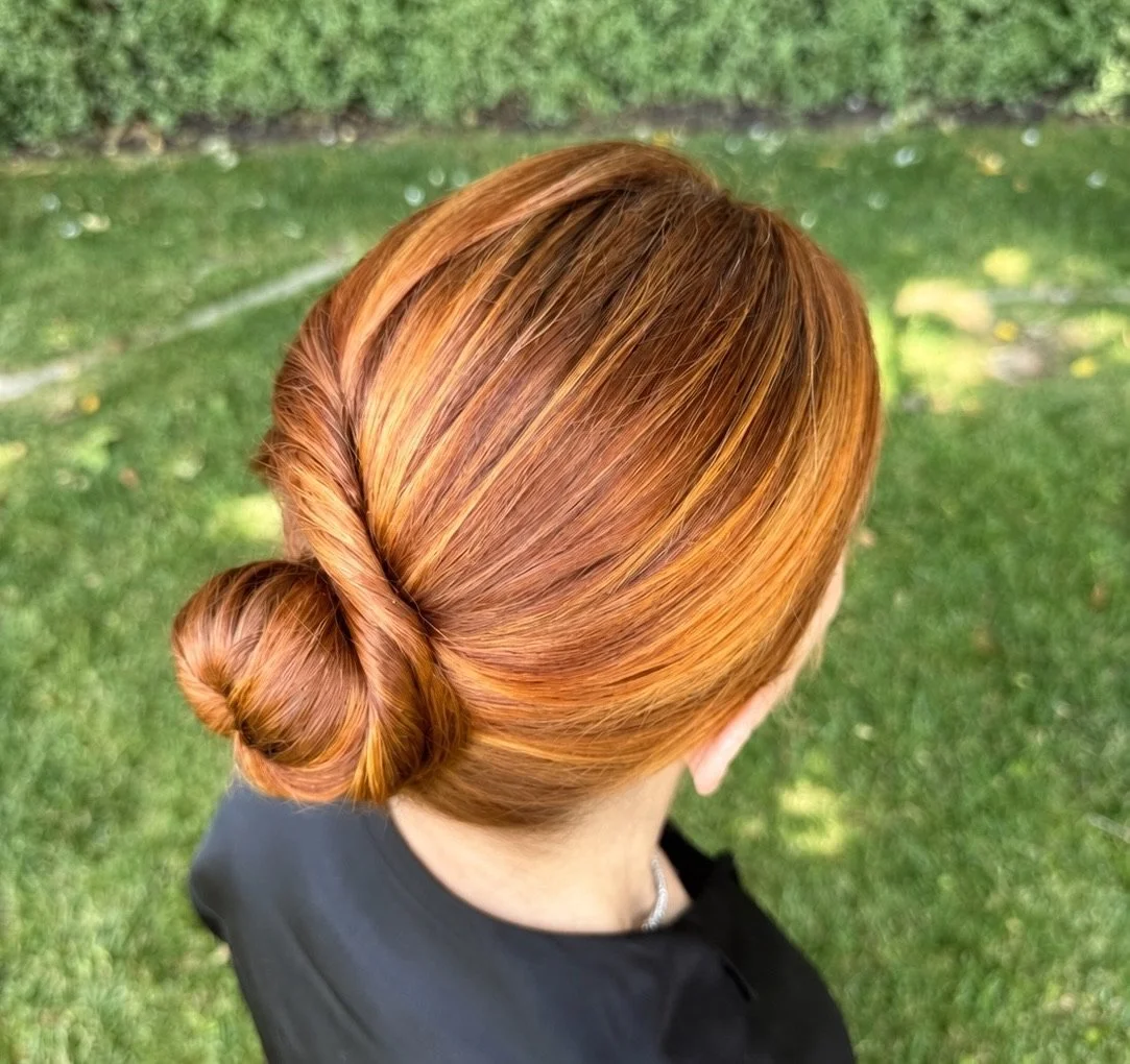 Elegant and sophisticated updo style with twist into a polished bun for mother-of the-bride from San Francisco