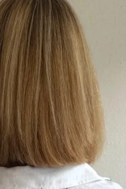 Hair after Magic Sleek Smoothing Treatment showing reduced frizz, smoother texture, improved shine, and healthier, more manageable hair.