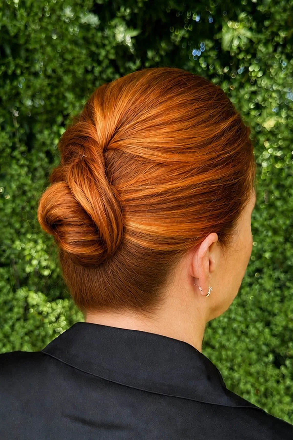 Mother of the bride hairstyle featuring a beautiful twisted low bun, styled by a Mill Valley wedding hairstylist serving Marin County.