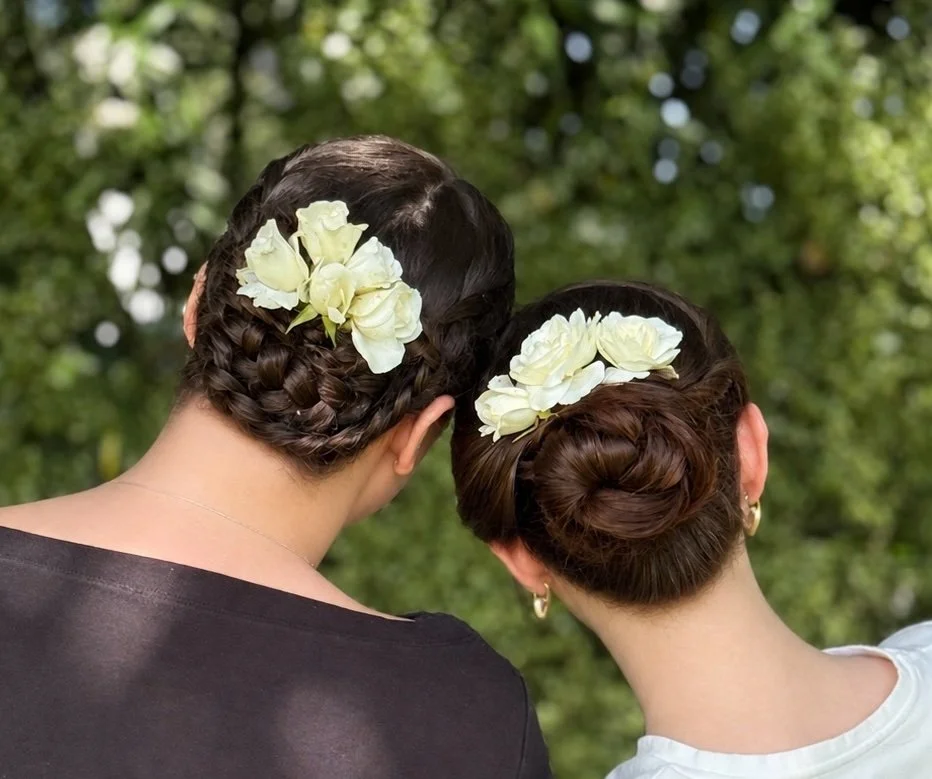 Two wedding style updos with braids and twists incorporated into a polished, elegant look