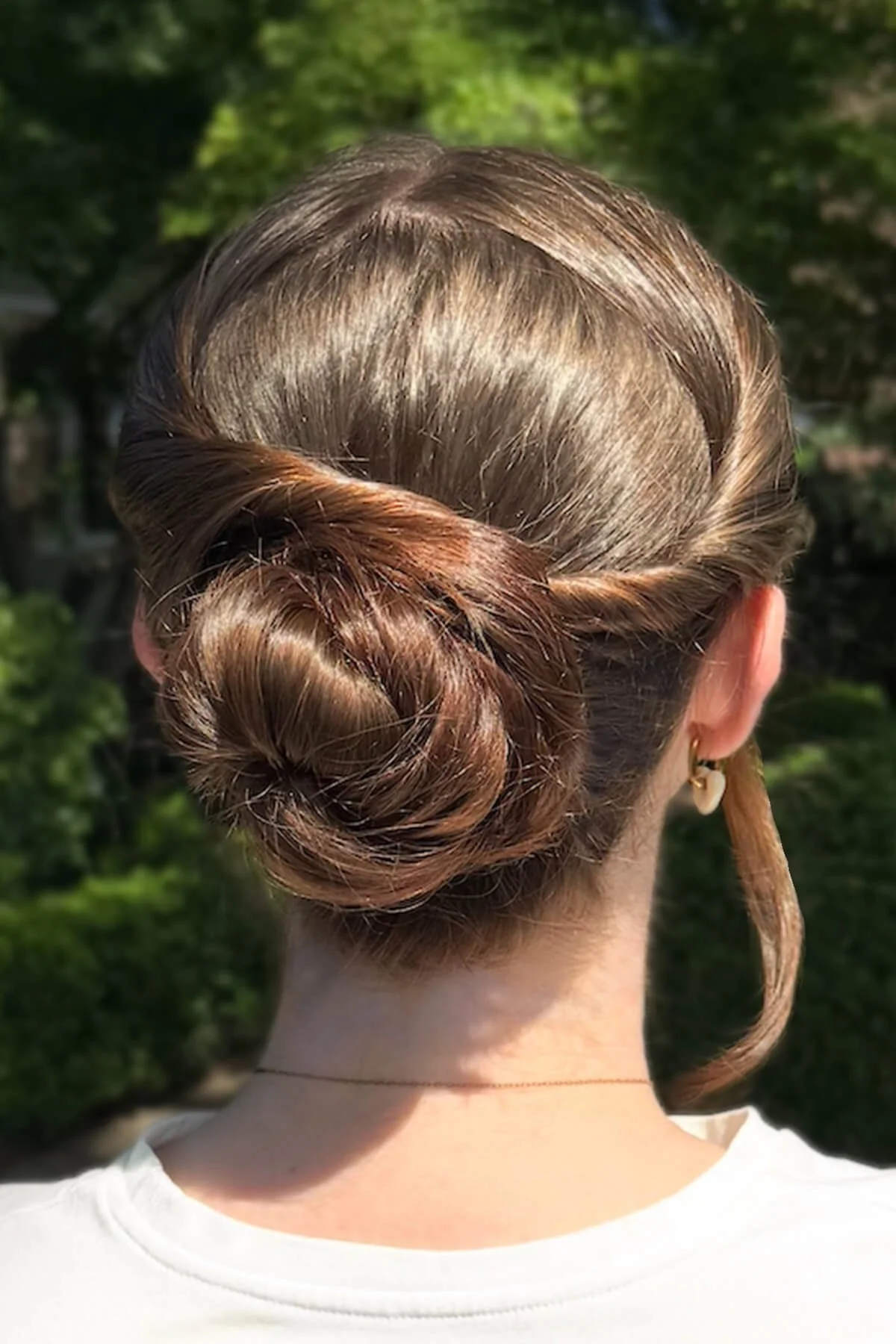 Formal updo hairstyle with a polished low bun created by Hair by Meg for special occasion hair styling in Mill Valley.