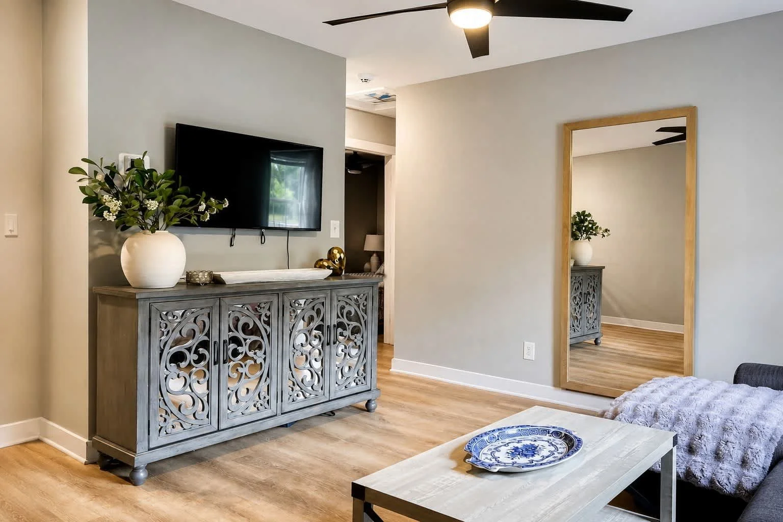 Furnished living room in a two-bedroom short-term rental in Raleigh, North Carolina, operated by Hyer Vantage