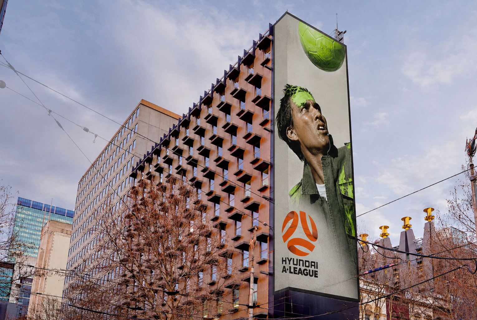 A-League launch campaign featuring large-scale outdoor advertising on a Melbourne building.