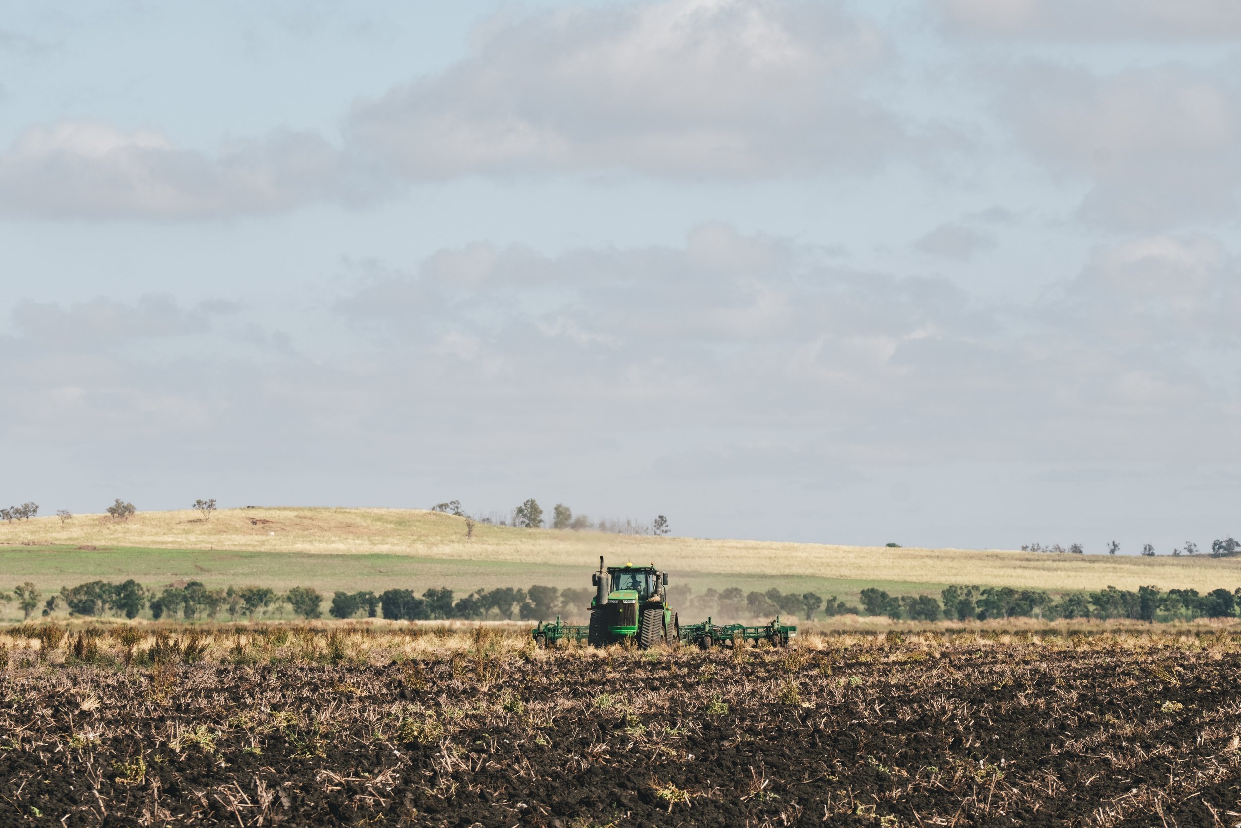 Broadacre cropping operation managed with modern agricultural machinery.