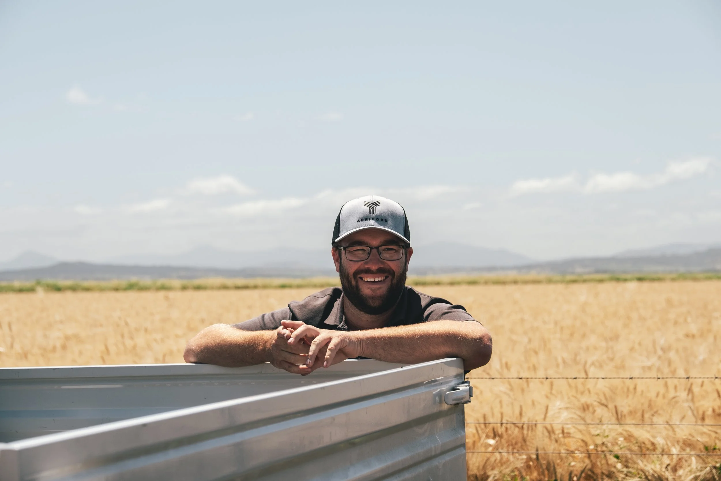 Agricore team member working with precision agriculture technology on-farm.