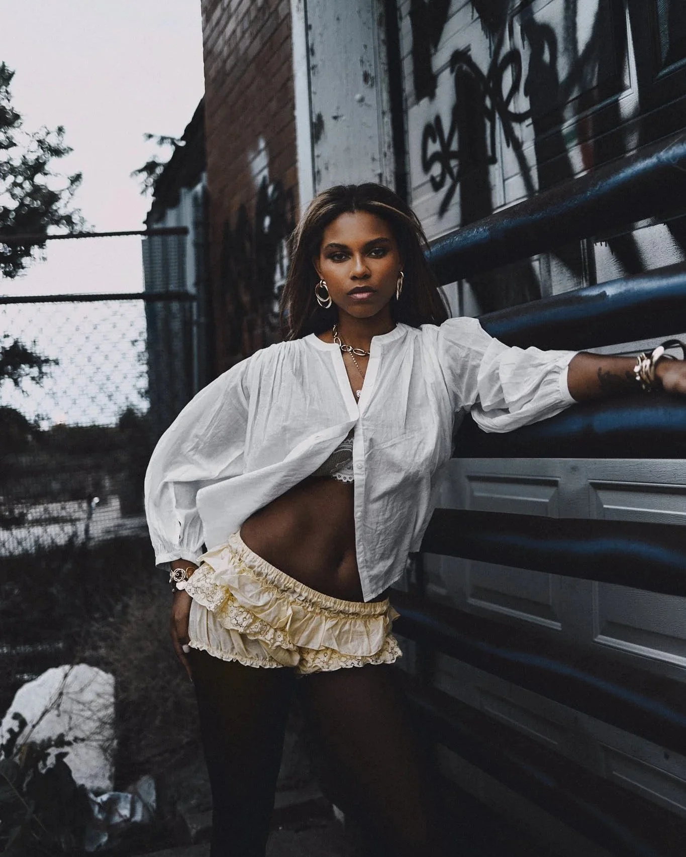 Editorial portrait of woman styled in white photographed outdoors in Denver, Colorado