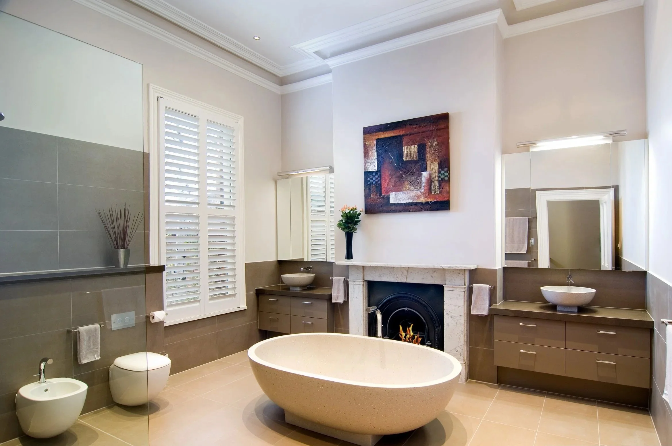 Open shower to the left, with fall in floor leaning back towards the left wall, bidet and toilet, and his and hers vanity, again a Bathroom award winner which won Bathroom of the year in 2019.