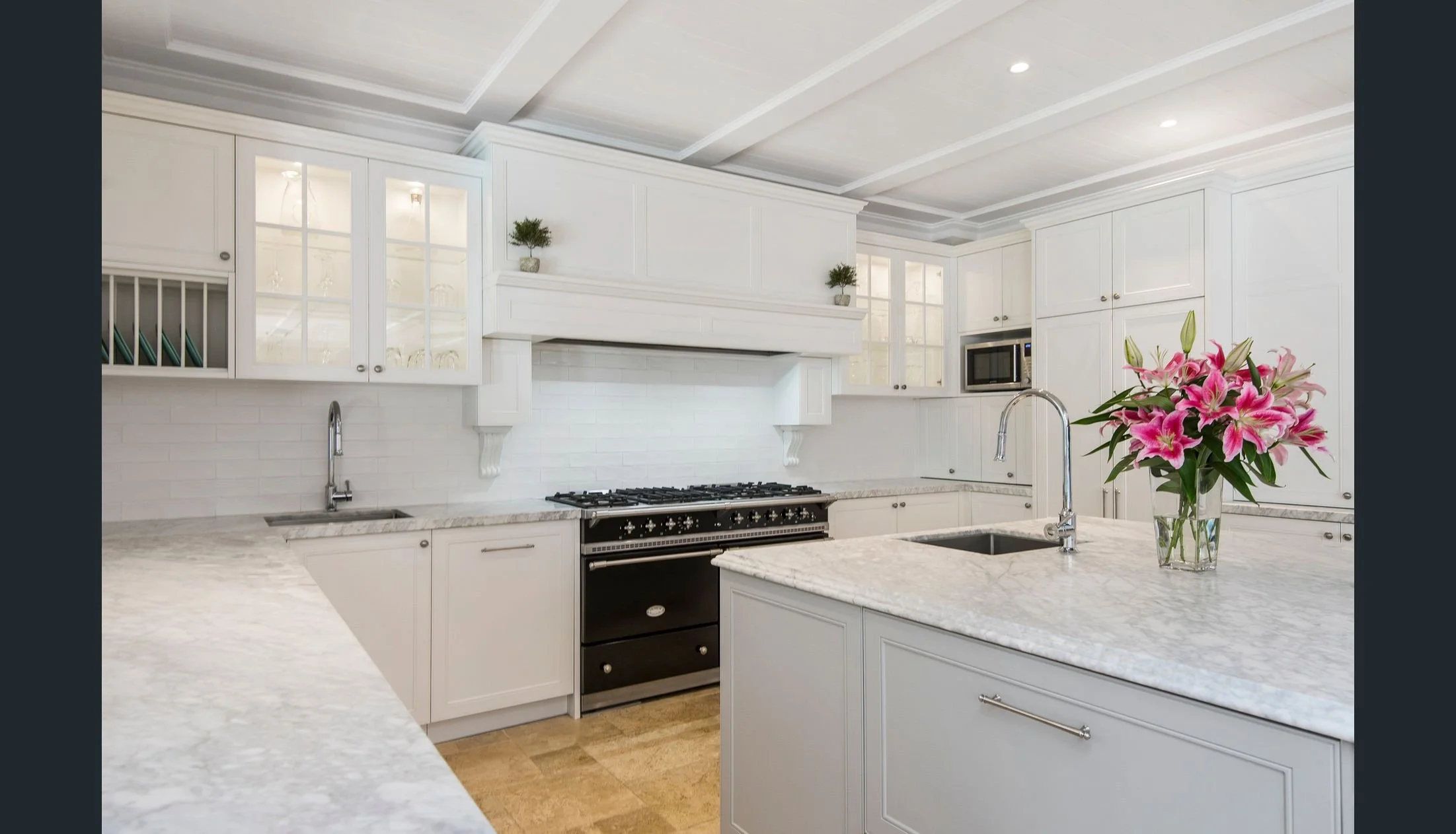 A true character classic kitchen with built in chimney, Lacanche French 1500mm oven, Marble benchtops, shaker doors incorporating built in fridge freezer behind doors, and top of the range Blum drawer and hinge systems and integrated appliances.