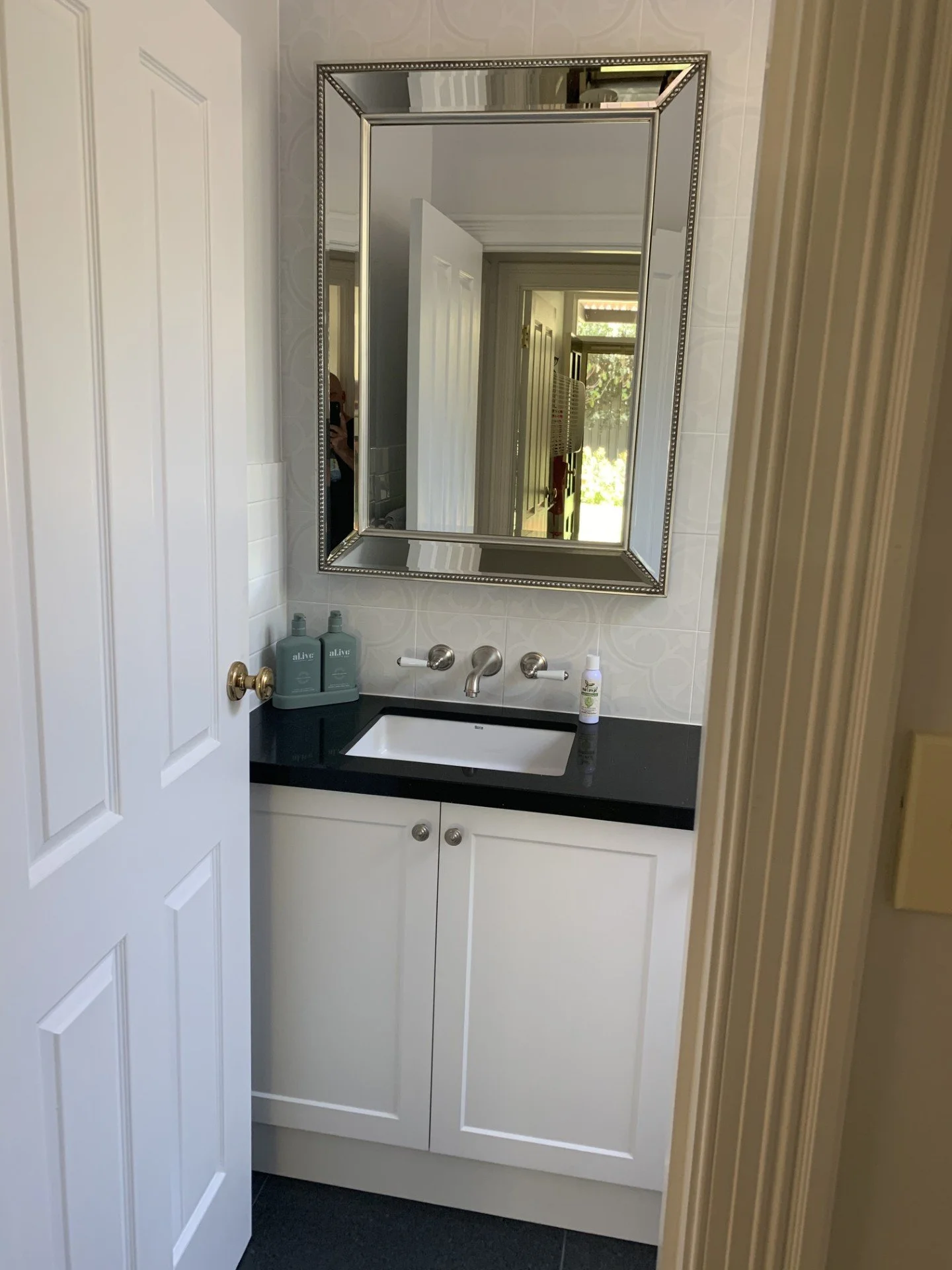 Beautiful custom-made vanity with luxury tapware, bevelled mirror shaker doors elegant and stylish.