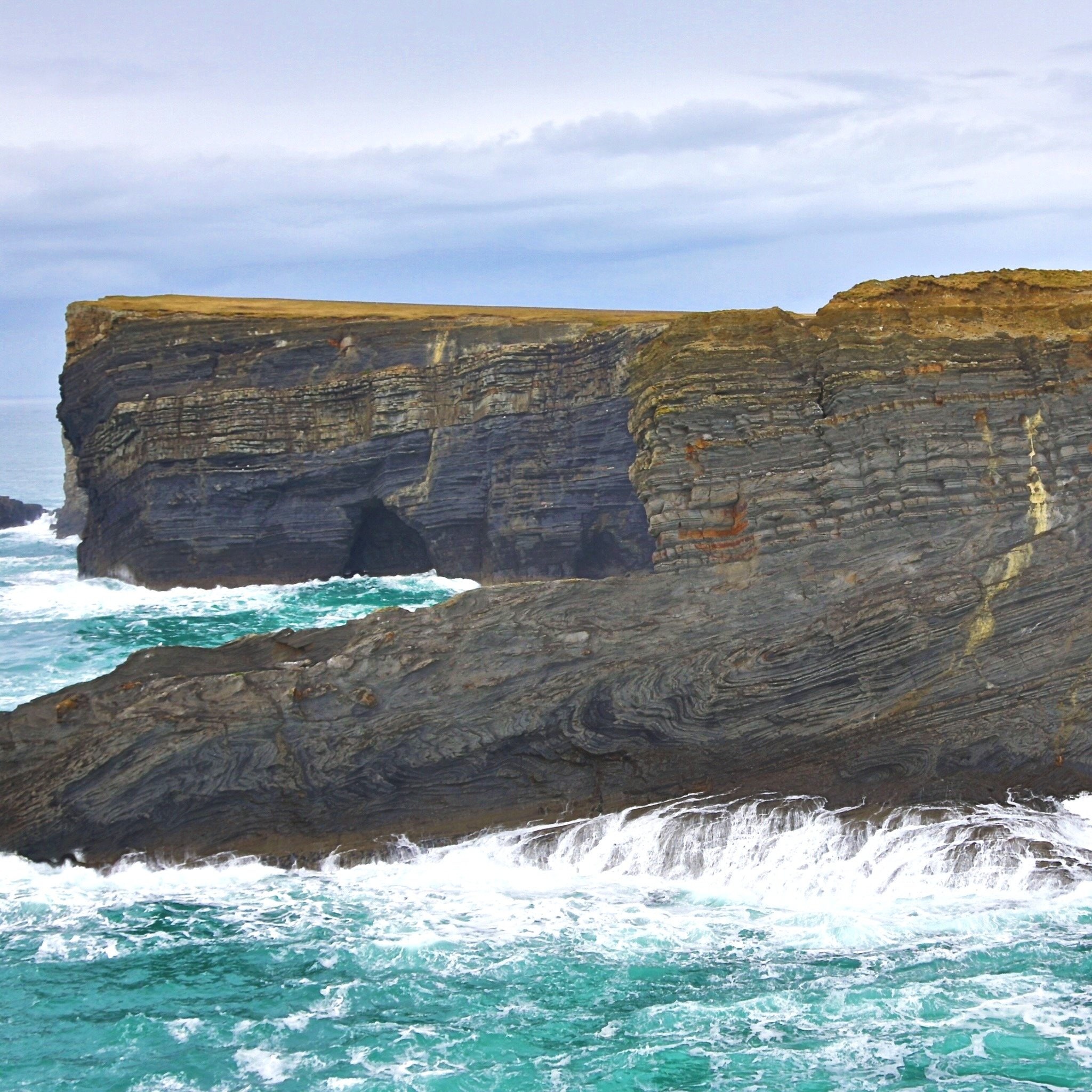 Uppermost slope and shelf edge mass-transport deposits exposed near Tullig Point, County Clare. The sandstones in the back are shelf and incised valley deposits of the deltaic Tullig Cyclothem.