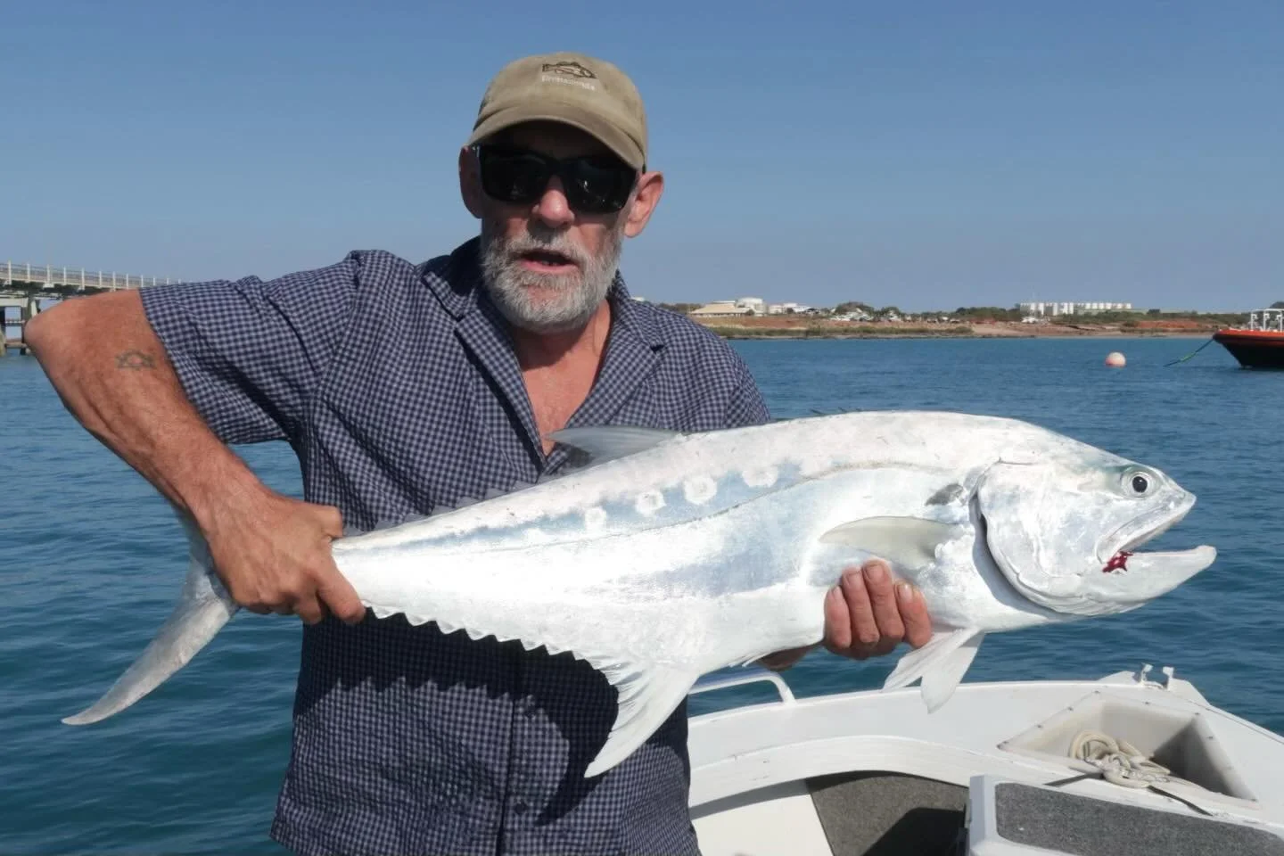 Big queenfish and a calm day out on the bay.