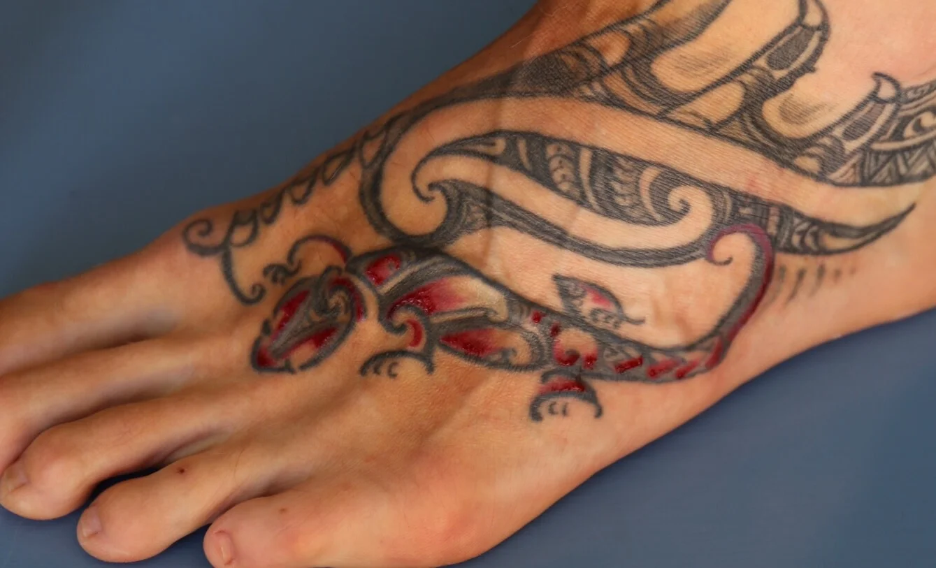 Red ink touch up on existing moko moko by Paitangi. 