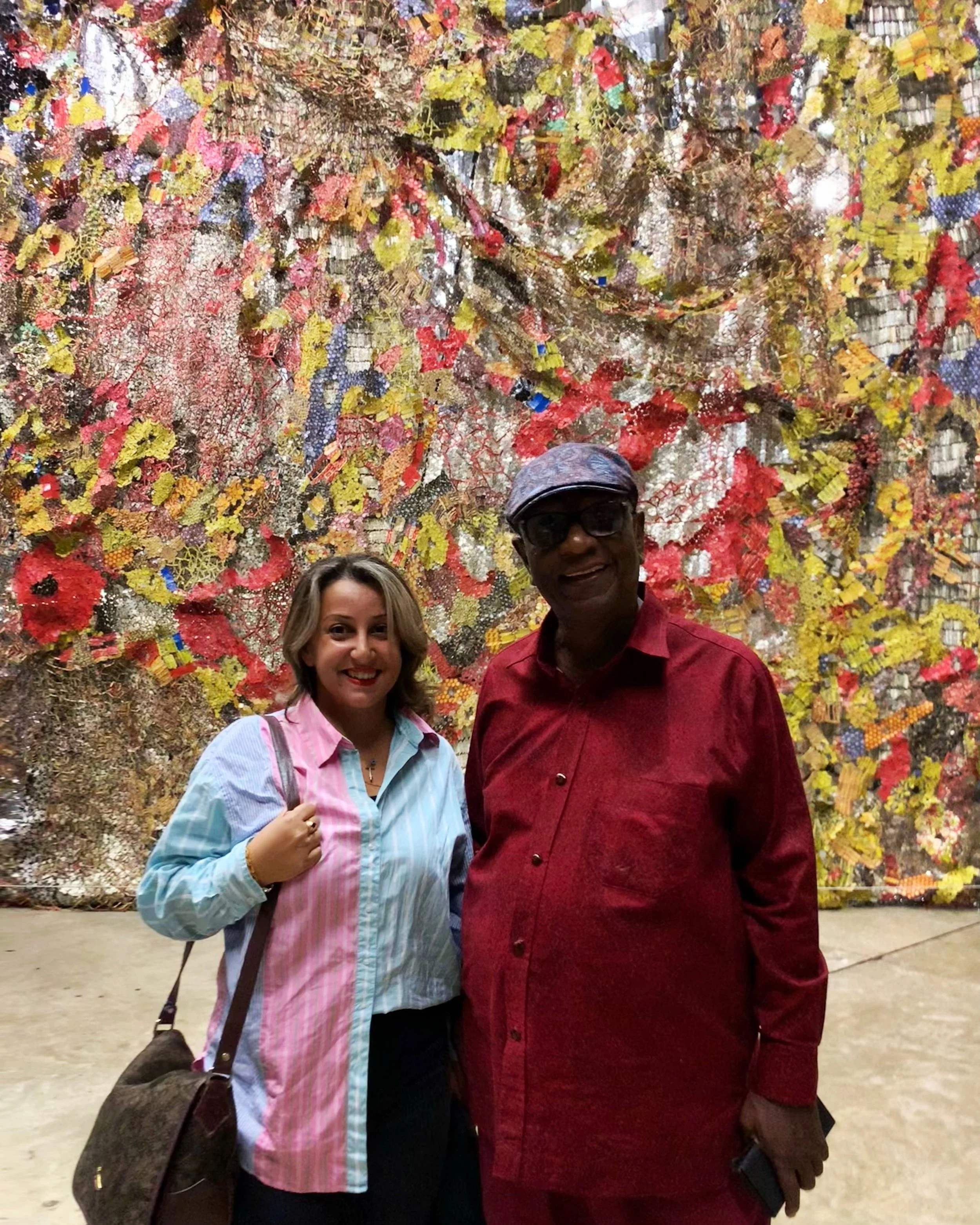 El Anatsui and producer Halime Eleni Özdemir di Larusso at the opening of his exhibition at Tate Modern.