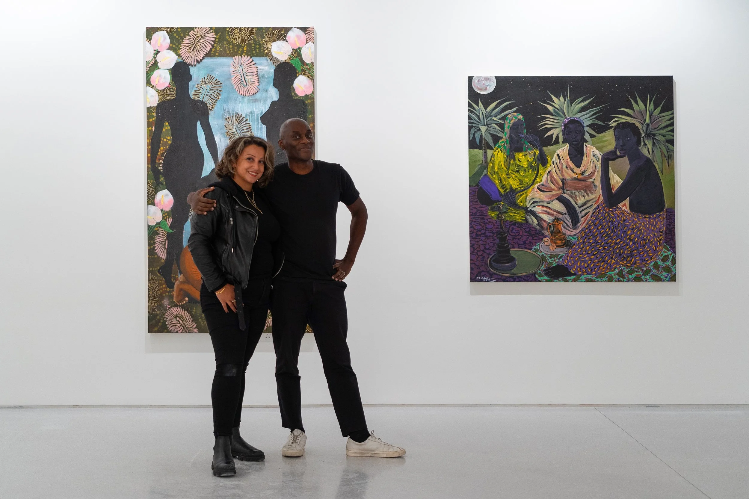 Exhibition Producer Halime Eleni Özdemir di Larusso with Ekow Eshun on production of 'Like Paradise' at Claridges ArtSpace, London.